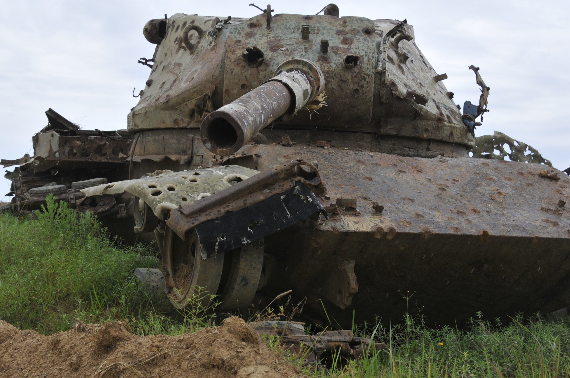 A US M-60 tank sits at 188th Wing Detachment 1 Razorback Range at Fort Chaffee Maneuver Training Center, Arkansas, July 14, 2014. The range is maintained by the 188th and provides varying types of training to military units from around the world. (U.S. Air National Guard photo by Staff Sgt. John Suleski/released)