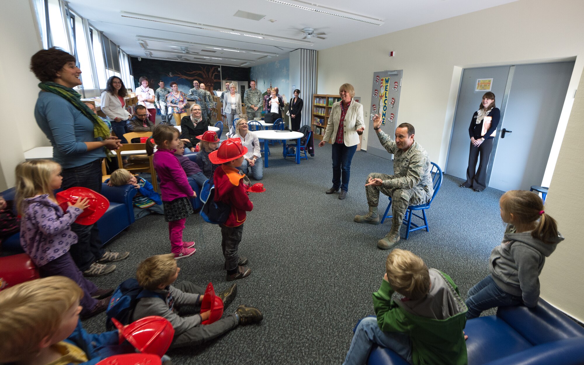 Lt. Gen. Noel Jones, U.S. Air Forces in Europe vice commander, talks to a group of children from the Villa Winzig Kindergarten during a tour of Ramstein Air Base, Germany, Oct. 2, 2014. With more than 50,000 American citizens living in the greater Kaiserslautern area, U.S. Air Force units have shared a 60-year partnership with their host nation counterparts and since 2009 several groups of German kindergarten children have visited Ramstein to continue those relationships. (U.S. Air Force photo/Airman 1st Class Jordan Castelan)