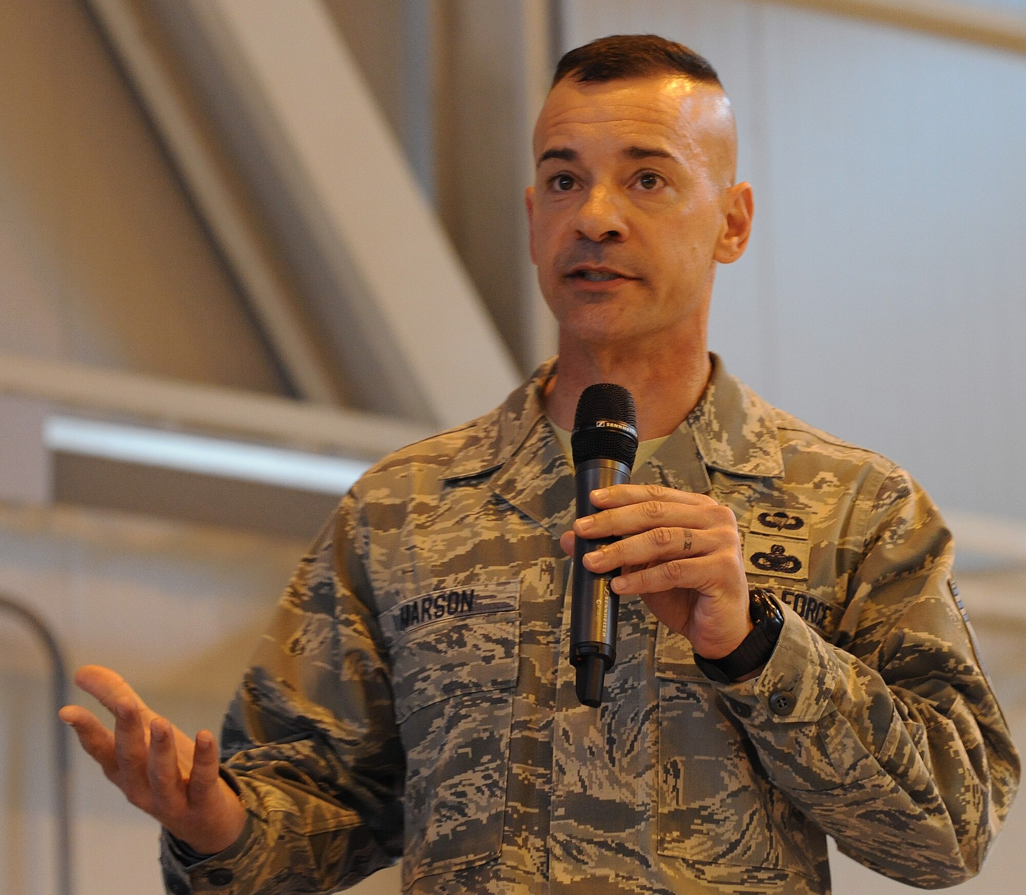 Chief Master Sgt. Mark Marson, 3rd Air Force command chief, speaks to Team Aviano during an all call, Oct. 8, 2014, at Aviano Air Base, Italy. Marson touched on several key issues to include force shaping measures and the new performance report program.  (U.S. Air Force photo/Senior Airman Matthew Lotz)