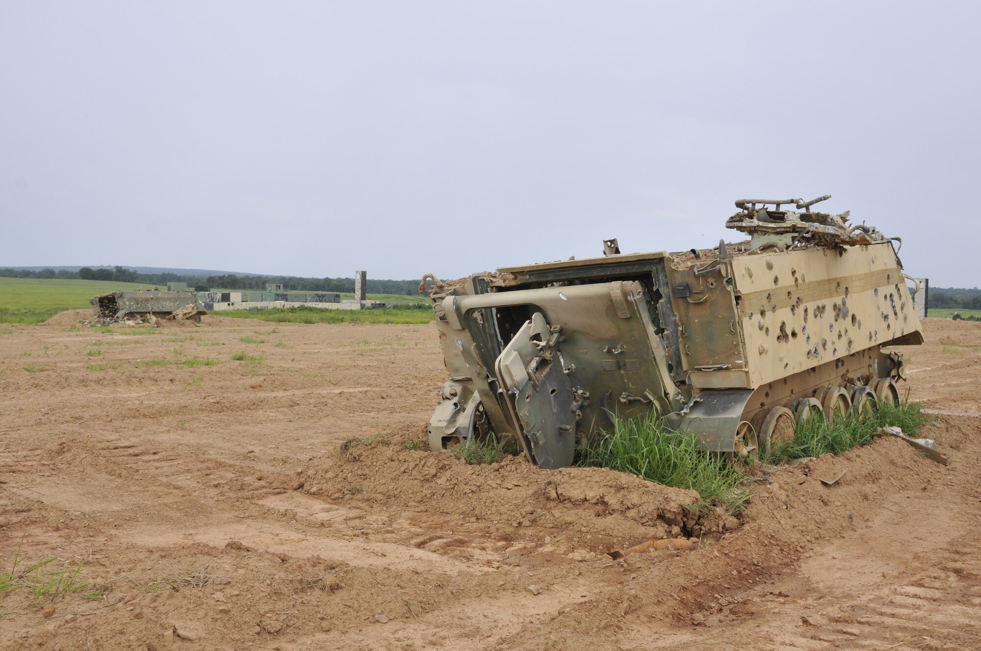 A US M-113 Armored Personnel Carrier sits at 188th Wing Detachment 1 Razorback Range at Fort Chaffee Maneuver Training Center, Arkansas, July 14, 2014. The range is maintained by the 188th and provides varying types of training to military units from around the world. (U.S. Air National Guard photo by Staff Sgt. John Suleski/released)