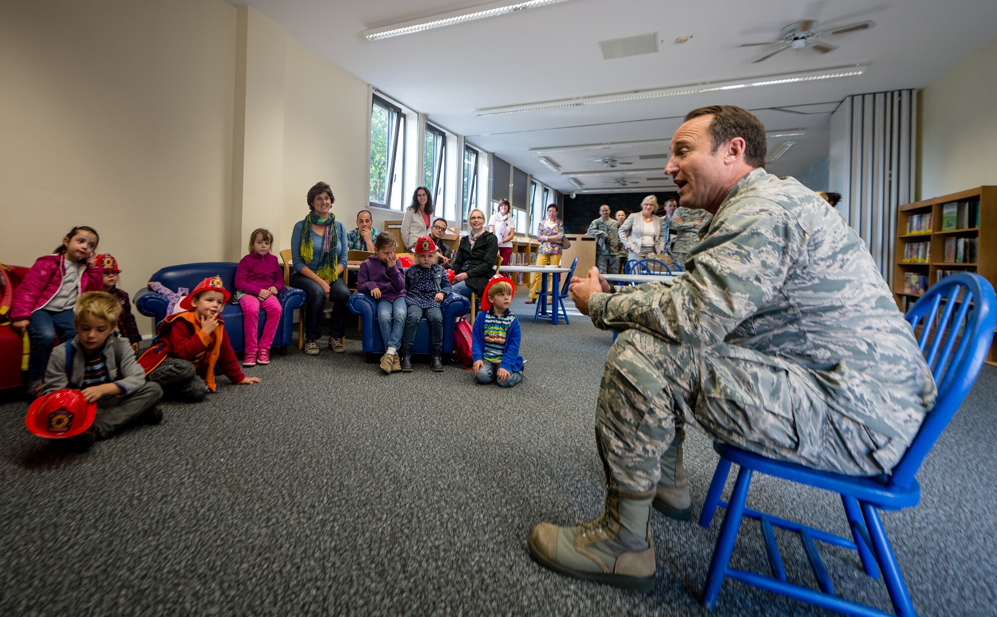 Lt. Gen. Noel Jones, U.S. Air Forces in Europe vice commander, talks to a group of children from the Villa Winzig Kindergarten during a tour of Ramstein Air Base, Germany, Oct. 2, 2014. With more than 50,000 American citizens living in the greater Kaiserslautern area, U.S. Air Force units have shared a 60-year partnership with their host nation counterparts and since 2009 several groups of German kindergarten children have visited Ramstein to continue those relationships. (U.S. Air Force photo/Airman 1st Class Jordan Castelan)