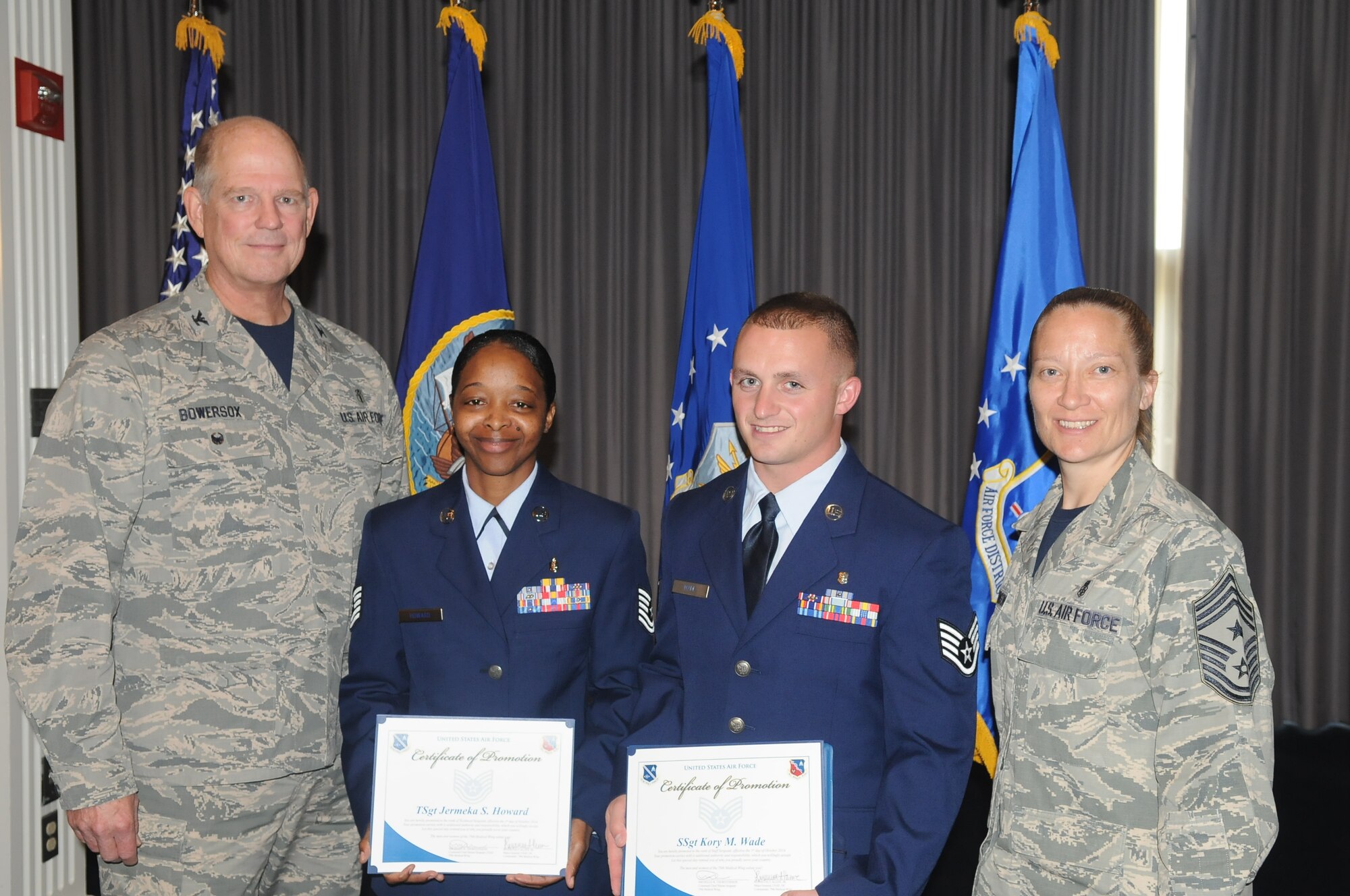 Senior Airman Kory Wade, Medical Logistics and Staff Sgt. Jermeka Howard, Medical Technician were presented with their promotion certificates from Colonel Robert Bowersox, 79th Medical Wing (79 MDW) Vice commander and Chief Master Sgt. MichelleThorsteinson-Ricahrds, 79 MDW Command Chief.
