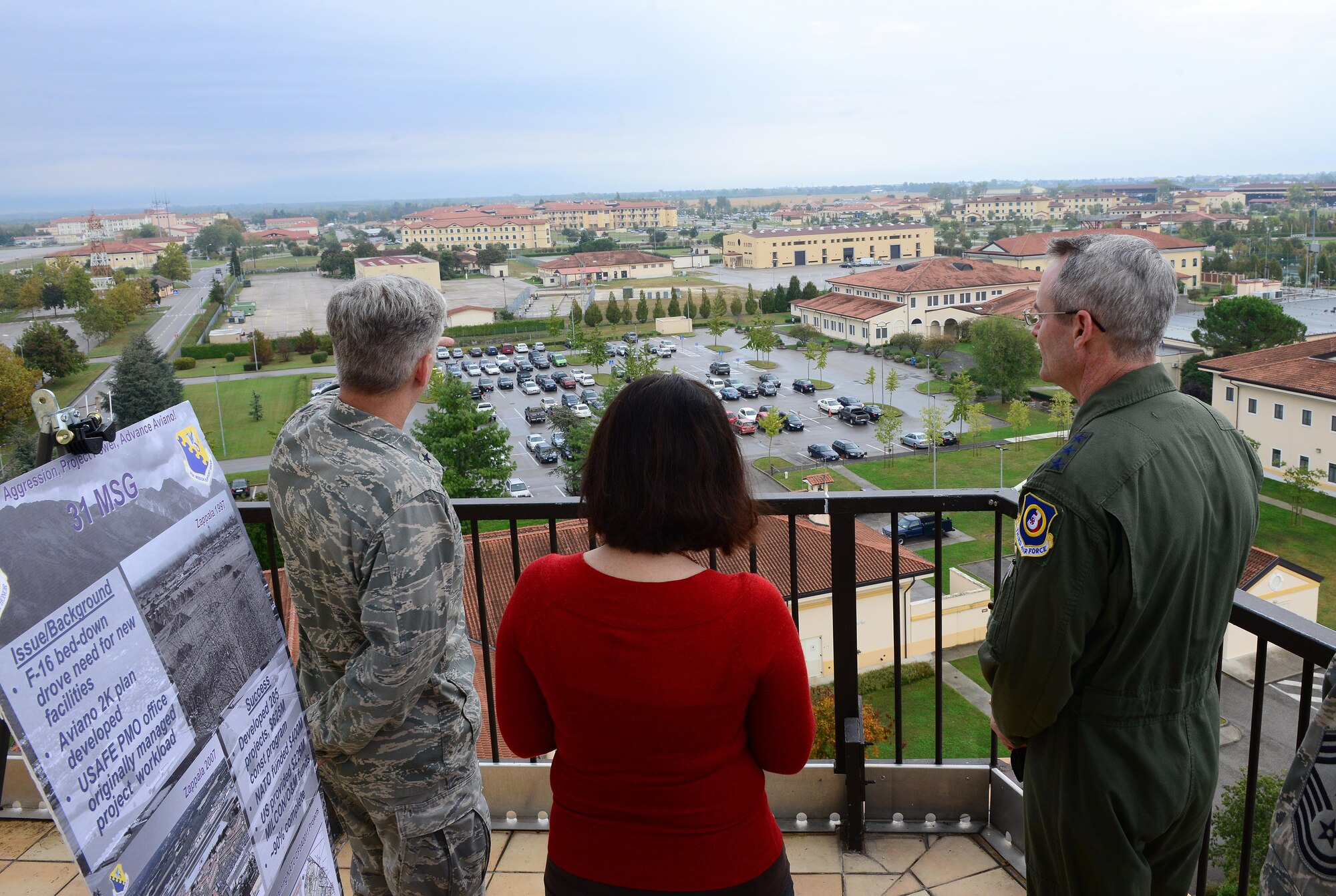 (From left) Brig. Gen. Barre Seguin, 31st Fighter Wing commander, and Sara Bierman, 31st Mission Support Group community planner, discusses base infrastructure during a visit with Lt. Gen. Darryl Roberson, 3rd Air Force commander, Oct. 8, 2014, at Aviano Air Base, Italy. Roberson visited several units and held an all call during his first visit as the 3rd Air Force commander. (U.S. Air Force photo/Senior Airman Matthew Lotz)