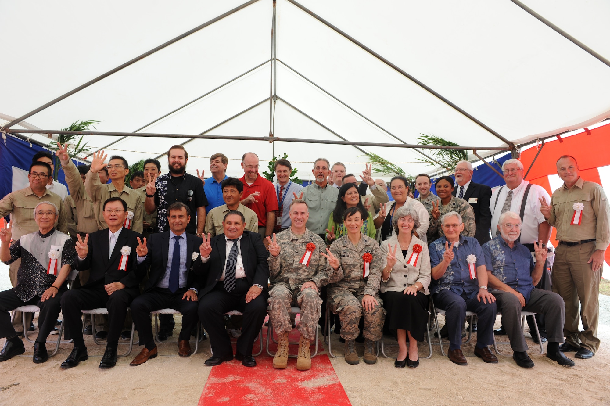 Key members of the ground breaking ceremony gather for a group photo on Kadena Air Base, Japan, Oct. 2, 2014. The school is being built as part of the Department of Defense Education Activities worldwide multi-year effort and is estimated to be completed by 2017. It will accommodate more than 800 students. (U.S. Air Force photo by Airman 1st Class Stephen G. Eigel) 