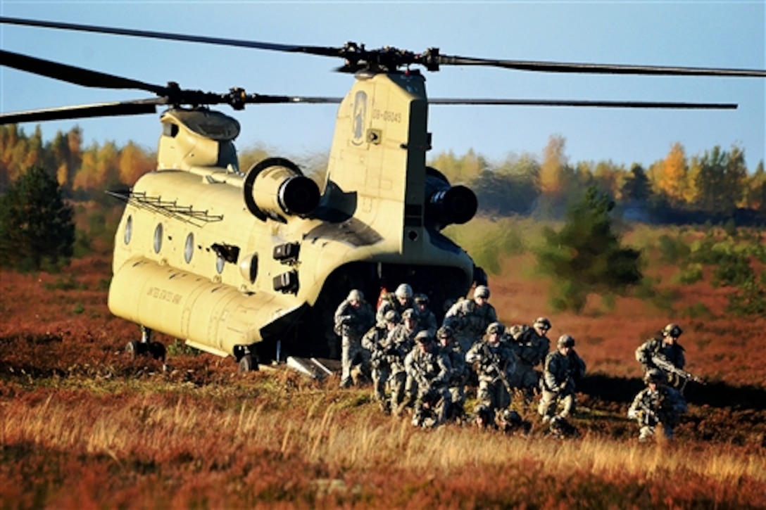 U.S. paratroopers disembark from a CH-47 Chinook helicopter during Operation Silver Arrow in Adazi, Latvia, Oct. 5, 2014. The multinational exercise includes forces from Latvia, Estonia, Great Britain, Norway and the Michigan Army National Guard, and is being held in conjunction with U.S. Army Europe and Operation Atlantic Resolve. The paratroopers are assigned to the 2nd Battalion, 503rd Infantry Regiment, 173rd Airborne Brigade, Airborne, Vicenza, Italy.