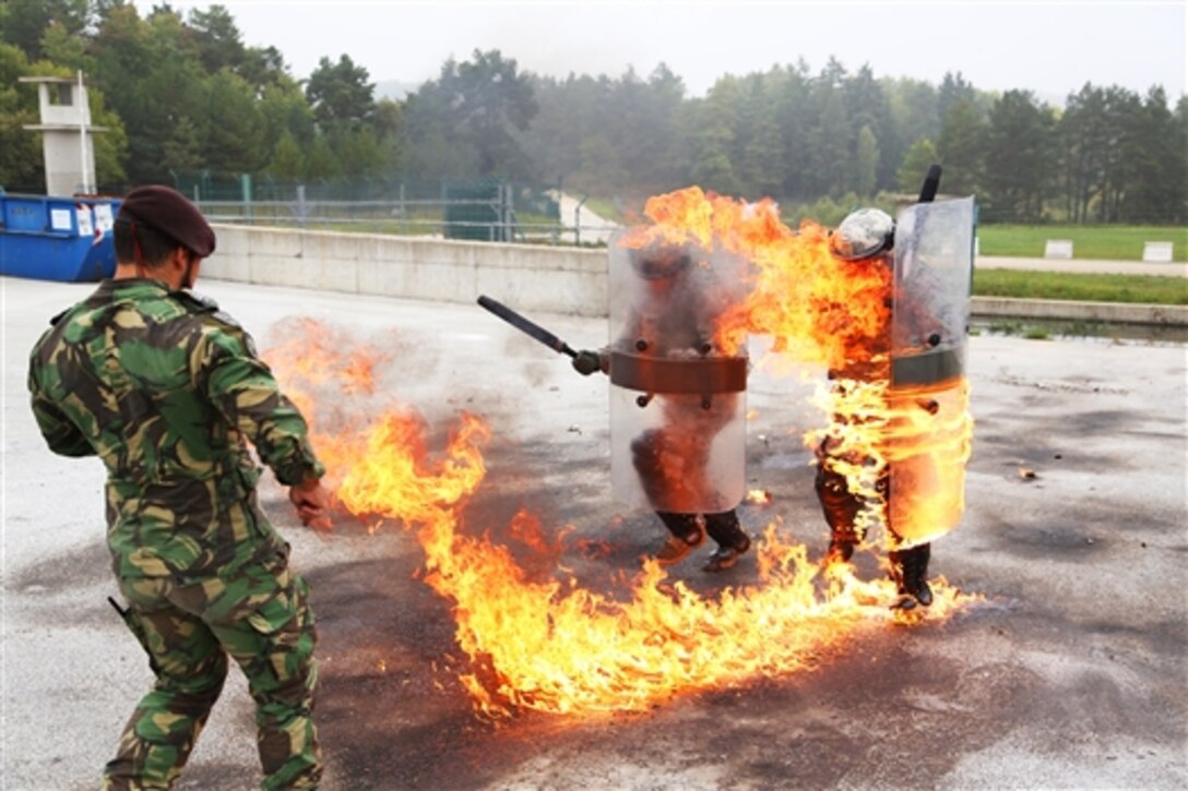 U.S. soldiers conduct fire phobia training during Rotation 14-09 on the Joint Multinational Readiness Center in Hohenfels, Germany, Oct. 4, 2014. The rotation is based on the current operational environment and is designed to prepare the unit for peace support, stability, and contingency operations. The soldiers are assigned to the 1st Battalion, 40th Cavalry Regiment.