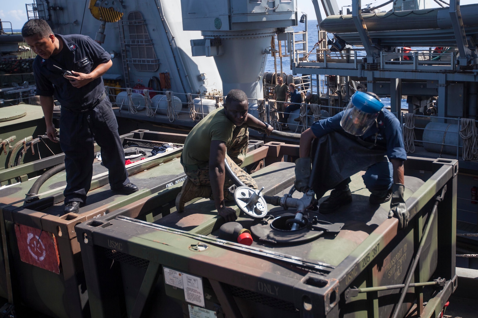 SUBIC BAY, Philippines – A U.S. Marine and two U.S. Navy sailors pump fuel into a 7-ton truck in preparation of Amphibious Landing Exercise 15 at Subic Bay, the Philippines, Sept. 28. PHIBLEX is an annual, bilateral training exercise conducted by members of the Armed Forces of the Philippines alongside U.S Marine and Navy forces focused on strengthening the partnership and relationships between the two nations across a range of military operations including disaster relief and complex expeditionary operations.  