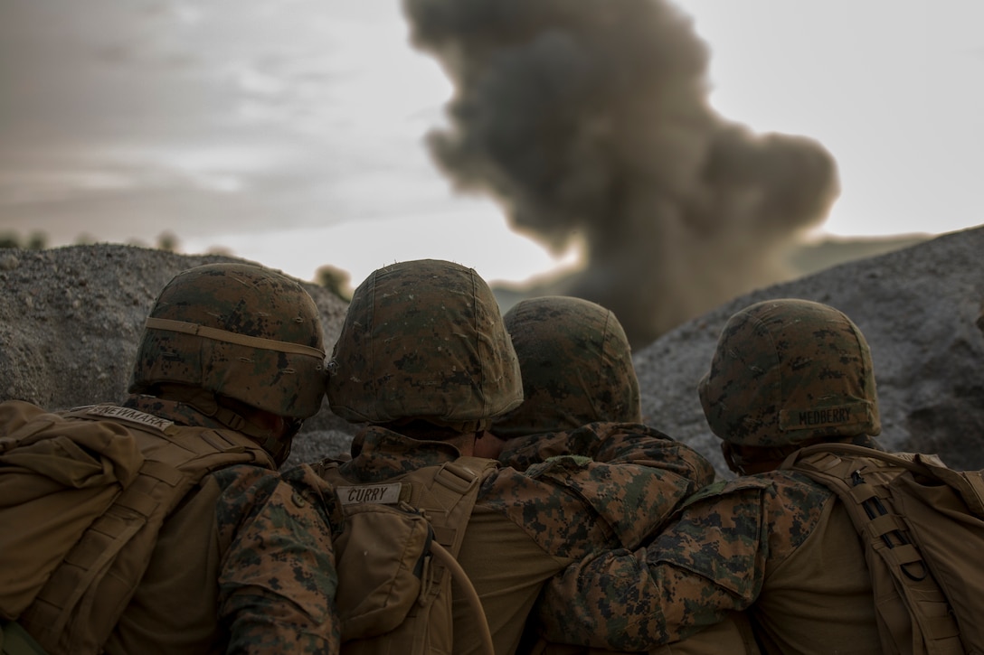 U.S. Marines observe explosives detonate from a safe distance on a demolitions range at Crow Valley, the Philippines, during Amphibious Landing Exercise 15, Oct. 8. PHIBLEX is an annual, bilateral training exercise conducted by members of the Armed Forces of the Philippines alongside U.S. Marine and Navy forces focused on strengthening the partnership and relationships between the two nations across a range of military operations including disaster relief and complex expeditionary operations. The Marines are with Battalion Landing Team 3rd Battalion, 5th Marines, 31st Marine Expeditionary Unit. 