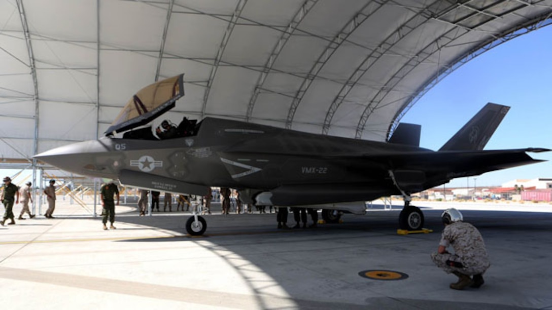 A F-35B Lightning II with Marine Operational and Test Evaluation Squadron 22 sits under a canopy while Marines conduct post flight checks aboard Edwards Air Force Base, Calif., Oct. 9. The F-35 Lightning II is scheduled to replace several Marine aircraft in the future. 