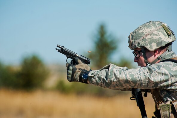 Capt. Kyle Yates provides cover during the tactics event of the Global Strike Challenge competition Sept. 24, 2014, on Camp Guernsey, Wyo. The security forces portion of the challenge was split into three different events: tactics, weapons firing, and the mental and physical challenge. Yates was the 91st Security Forces Group Global Strike Challenge team leader. (U.S. Air Force photo/Senior Airman Brittany Y. Bateman)