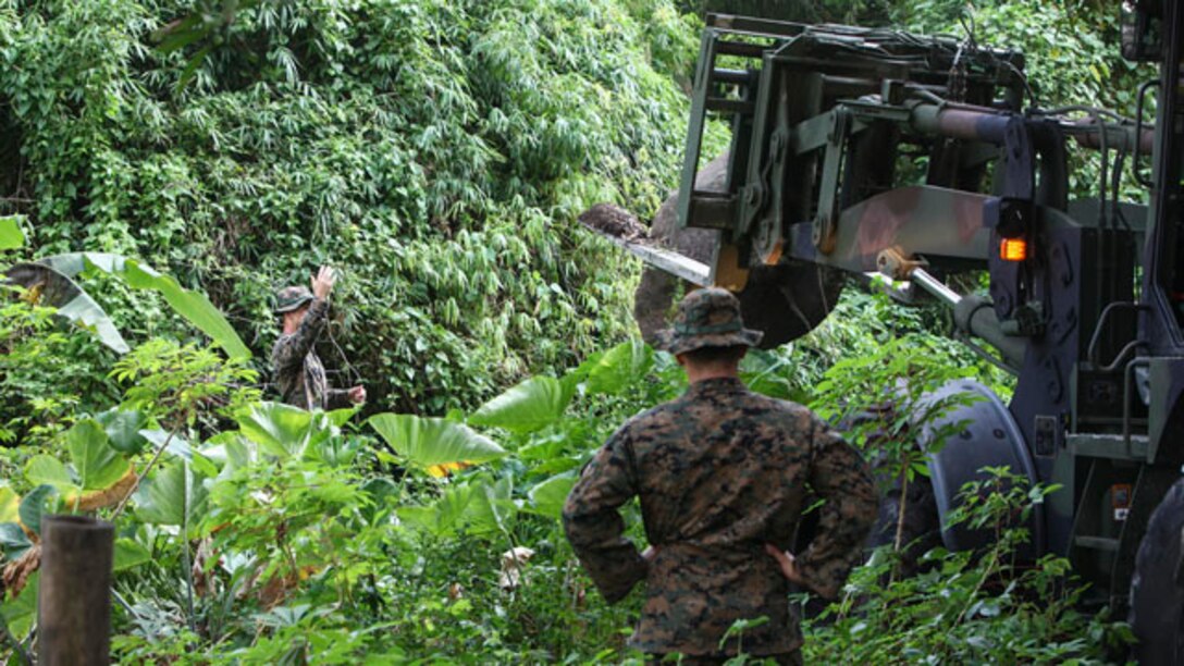 U.S. Marines move a large boulder using a tractor rubber-tire articulate-steering multipurpose vehicle, or TRAM, during Amphibious Landing Exercise 15 at Marine Corps Base Gregorio Lim in Ternate, the Philippines, Oct. 7. PHIBLEX is an annual, bilateral training exercise conducted by members of the Armed Forces of the Philippines alongside U.S Marine and Navy forces focused on strengthening the partnership and relationships between the two nations across a range of military operations including disaster relief and complex expeditionary operations. The U.S. Marines are with Combat Logistics Battalion 31, 31st Marine Expeditionary Unit. 