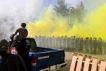 Arizona National Guard, 1st Battalion, 158th Infantry Regiment Soldiers, together with Moldovan soldiers, face an aggressive crowd of rioters throwing smoke and rocks during a situational training exercise as part of Steppe Eagle 2014 exercise, Oct. 4, at the Joint Multinational Readiness Training Center in Hohenfels, Germany. 