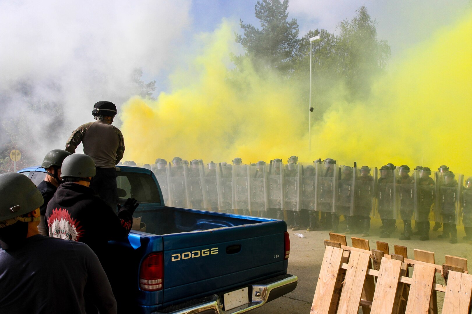 Arizona National Guard, 1st Battalion, 158th Infantry Regiment Soldiers, together with Moldovan soldiers, face an aggressive crowd of rioters throwing smoke and rocks during a situational training exercise as part of Steppe Eagle 2014 exercise, Oct. 4, at the Joint Multinational Readiness Training Center in Hohenfels, Germany. 