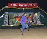 Cal Guard sergeants Jasleen and Bree Khaira get into a groove during a social event organized by the Indian Army on Sept. 24.