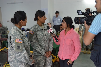 Cal Guard Sgt. Jasleen Khaira, left, and Staff Sgt. Balreet Khaira are interveiwed by the Indian media on Sept. 29 at Ranikhet Cantonment, India, during Yudh Abhyas 2014, which took place Sept. 17-30, 2014.