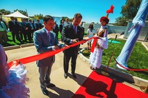 Defense Threat Reduction Agency Director Ken Meyers (center) assists with cutting the ribbon signifying the opening the 7,535 square foot Bio-Safety Level-3 facility addition in Otar, Kazakhstan Aug. 27. Huntsville Center provides construction management oversight and engineering support in designing and building the BSL-3 facility as well as an 86,111 square foot Central Reference Laboratory in Almaty, Kazakhstan. DTRA supports cooperative agreements with host nations focused on bio-terror threats outside the continental U.S. by providing facilities and equipment to monitor and detect potential endemic threats. In addition to the two facilities in Kazakhstan, Huntsville Center also supports DTRA with a rehabilitation of existing facilities in Armenia, Kenya and a Central Public Health Laboratory and National Public Health Laboratory in Afghanistan.