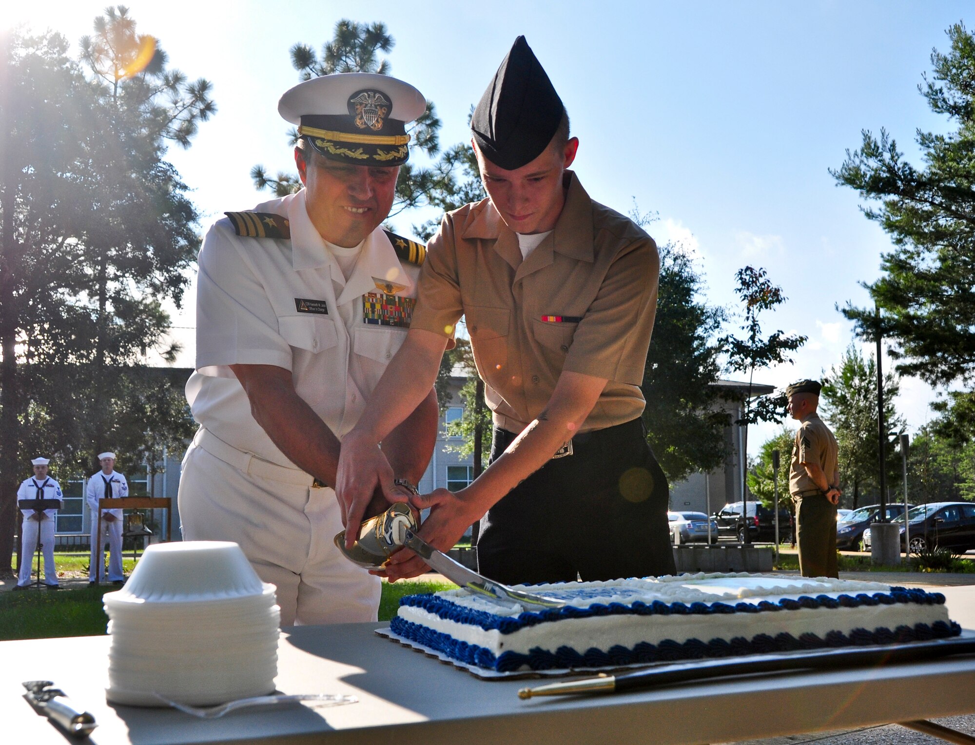 Commander Kenneth Jalali, Center of Naval Aviation Technical Training Detachment Eglin Air Force Base officer in charge, and the youngest Sailor cut a cake after celebrating the Navy’s 239th birthday, Oct. 10 on Eglin Air Force Base, Fla. In 1972, Adm. Elmo R. Zumwalt, Chief of Naval Operations, authorized Oct. 13th as the Navy’s birthday; one of two Navy-wide dates to be celebrated annually. (U.S. Air Force photo/Staff Sgt. Marleah Robertson)