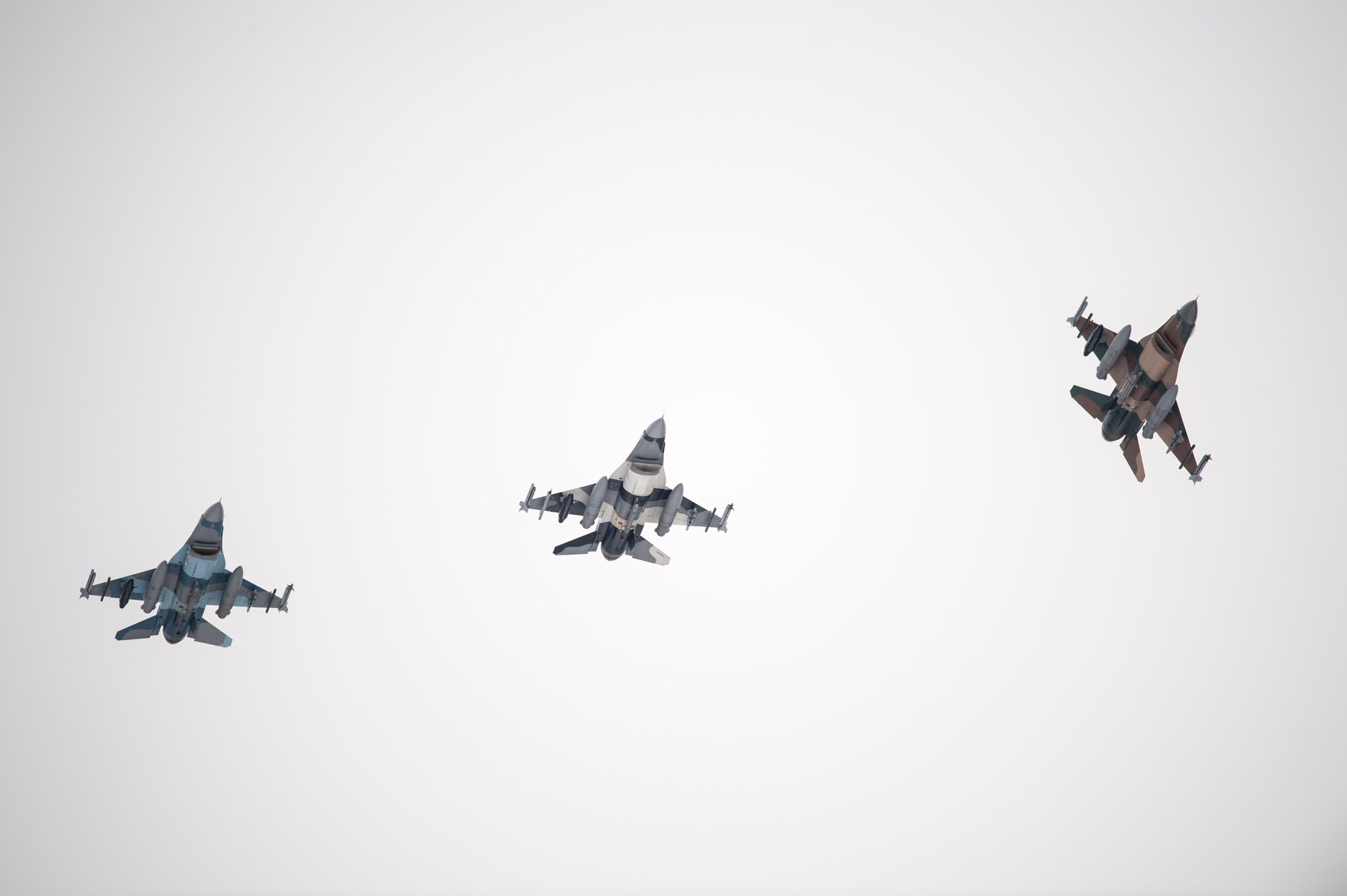 A U.S. Air Force F-16 Fighting Falcon fighter aircraft assigned to the 18th Aggressor Squadron breaks formation before landing after a sortie at Eielson Air Force Base, Alaska, Oct. 6, 2014, during RED FLAG-Alaska 15-1. RF-A is a series of Pacific Air Forces commander-directed field training exercises for U.S. and partner nation forces, providing combined offensive counter-air, interdiction, close air support and large force employment training in a simulated combat environment. (U.S. Air Force photo by Senior Airman Peter Reft/Released)