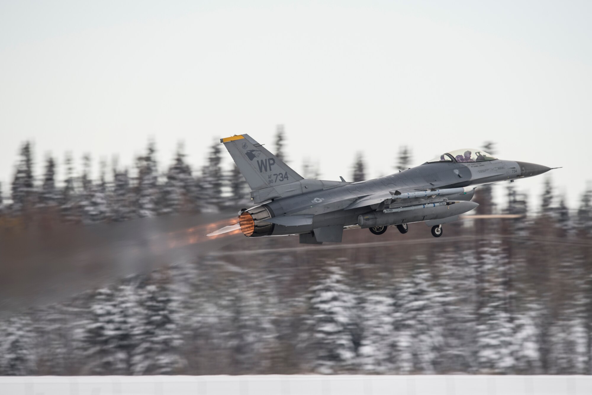 A U.S. Air Force F-16 Fighting Falcon fighter aircraft assigned to the 35th Fighter Squadron, Kunsan Air Base, South Korea, takes off for a sortie at Eielson Air Force Base, Alaska, Oct. 6, 2014, during RED FLAG-Alaska 15-1. RF-A is a series of Pacific Air Forces commander-directed field training exercises for U.S. and partner nation forces, providing combined offensive counter-air, interdiction, close air support and large force employment training in a simulated combat environment. (U.S. Air Force photo by Senior Airman Peter Reft/Released)