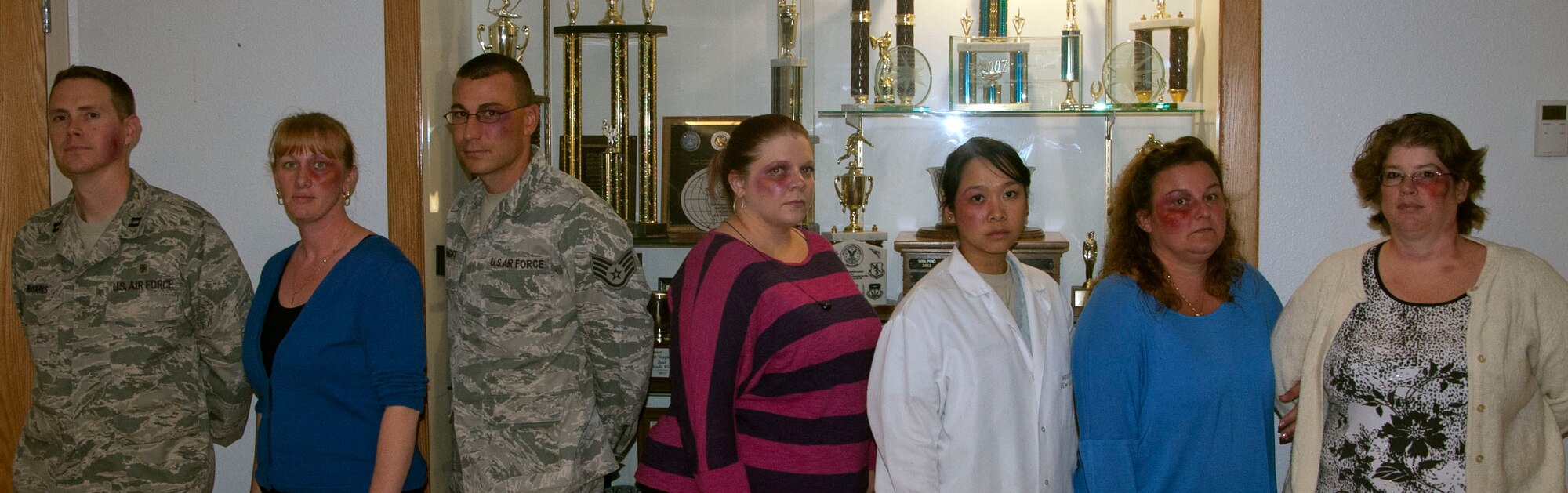 Volunteers from the 90th Medical Group used makeup to give the appearance that they had black eyes Oct. 8 in an attempt to create reactions from those who work with them or who saw them during the day. The experiment, called the Black Eye Campaign, is designed to raise awareness of domestic abuse around the base. (U.S. Air Force photo by Airman 1st Class Brandon Valle)
