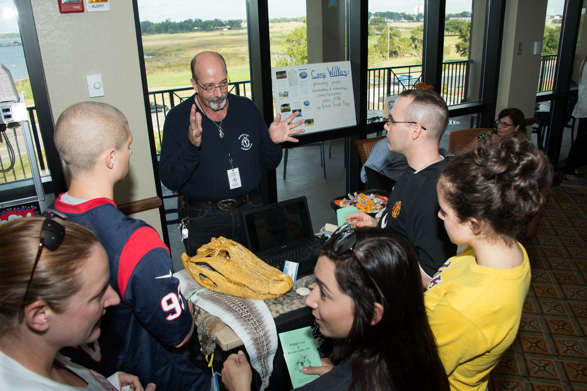 Staff Sgt. Charles Wolf and Airman 1st Class Mitchell Jennings, 81st Medical Support Squadron, explore available volunteer opportunities with Billy Payne, president of Wildlife Care and Rescue Center, Inc., during the Combined Federal Campaign kickoff Oct. 3, 2014, at Keesler Air Force Base, Miss. The CFC runs Oct. 1 through Nov. 14, and is the world’s largest annual federal charity campaign with more than 170 campaigns across the U.S. and internationally. (U.S. Air Force photo by Marie Floyd)