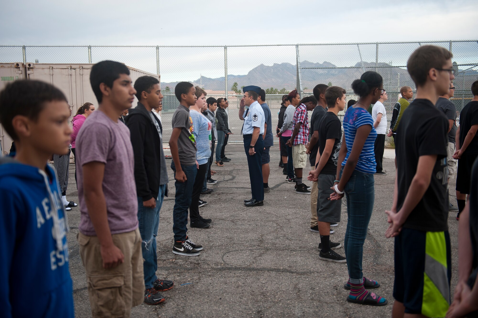 Retired Master Sgt. Carl Vetter, assistant Aerospace Science instructor at Cimarron-Memorial High School, conducts an open ranks inspection on his Junior Reserve Officer Training Corps class at CMHS in Las Vegas, Oct. 7, 2014. After serving as an independent duty medical technician in the U.S. Air Force for more than 26 years, Vetter retired, and through the Troops to Teachers program, started his JROTC instructor position at CMHS. (U.S. Air Force photo by Staff Sgt. Siuta B. Ika)