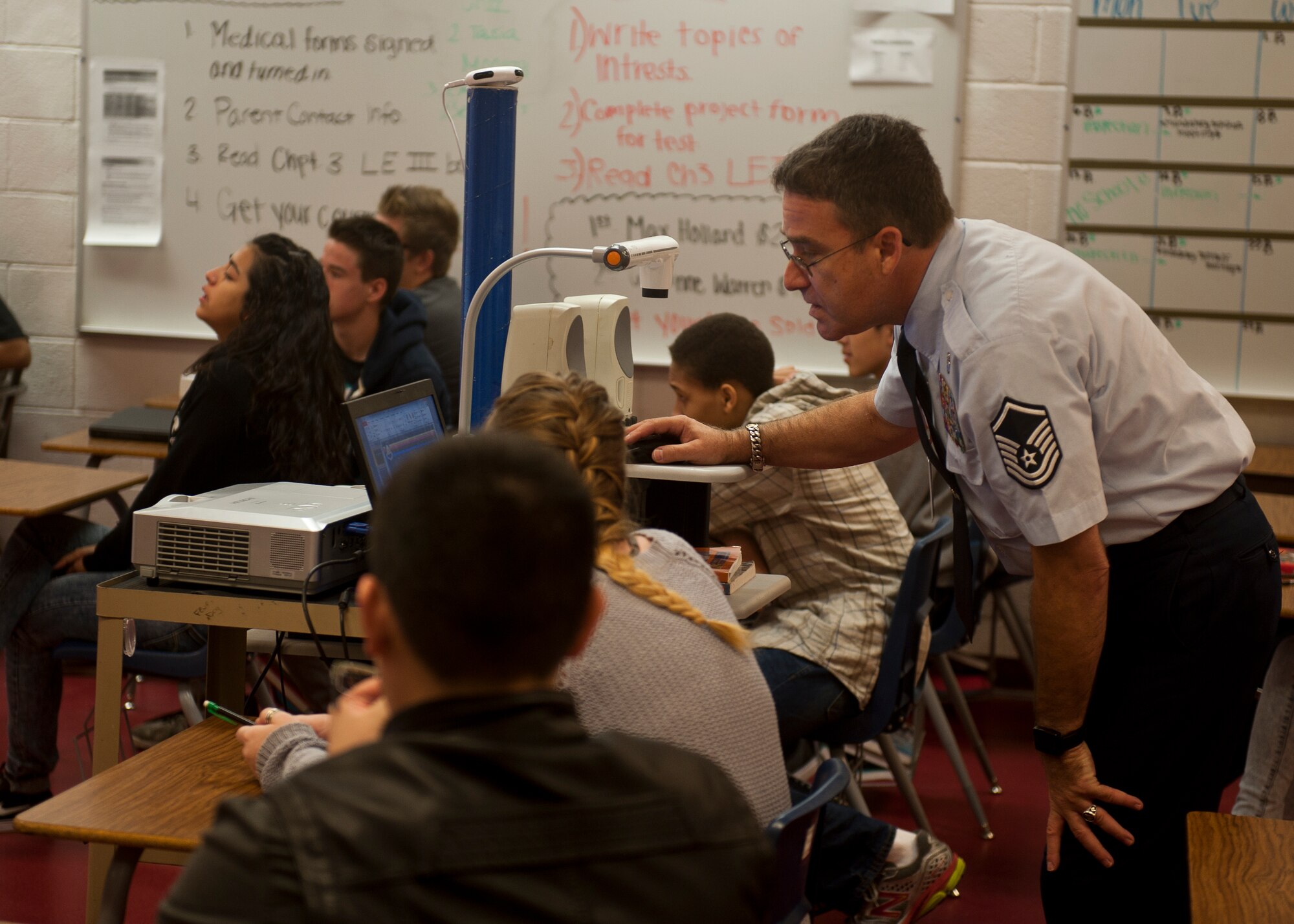 Retired Master Sgt. Carl Vetter, assistant Aerospace Science instructor at Cimarron-Memorial High School, sets up a lesson plan at CMHS in Las Vegas, Oct. 7, 2014. The Troops to Teachers program, whose goal is to help separating military members gain employment in public, private and charter schools, has helped place more than 200 former military members like Vetter in classrooms throughout the Clark County School District over the last couple of years. (U.S. Air Force photo by Staff Sgt. Siuta B. Ika)