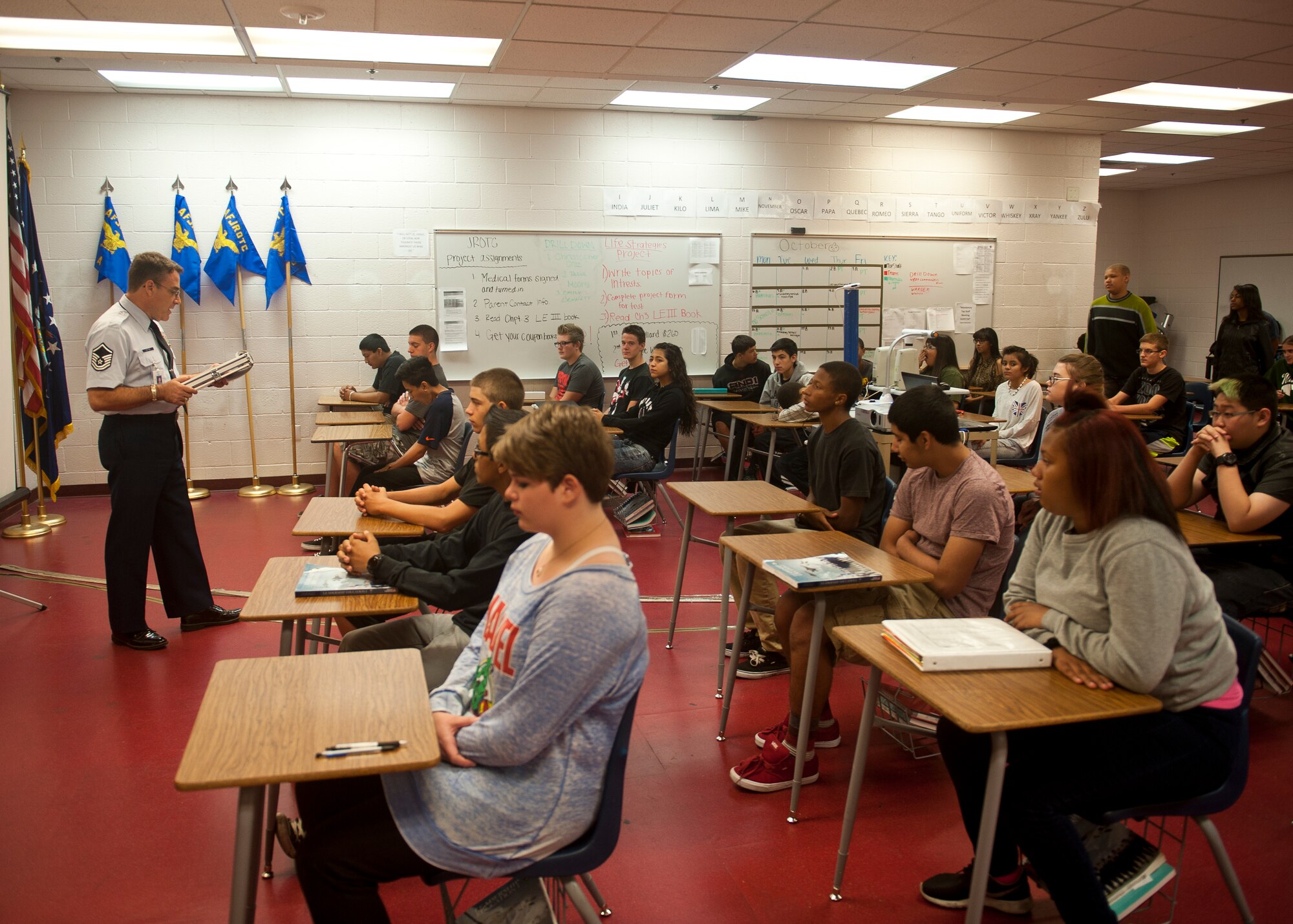 Retired Master Sgt. Carl Vetter, assistant Aerospace Science instructor at Cimarron-Memorial High School, instructs his class in Las Vegas, Oct. 7, 2014. After retiring from active duty service in 2008, Vetter worked various jobs in the local community before the Troops to Teachers program linked him with the JROTC teaching position at CMHS. (U.S. Air Force photo by Staff Sgt. Siuta B. Ika)