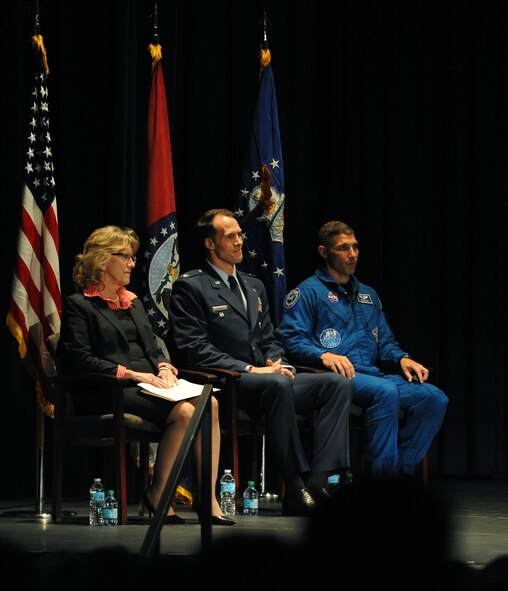 U.S. Air Force Cols. Michael Hopkins, right, NASA astronaut, and Matthew Brooks, center, 509th Bomb Wing vice commander from Whiteman Air Force Base, Mo., and Paula Hertwig-Hopkins, Hopkins’ stepmother, look on during the Ike Skelton Lecture event at the University of Central Missouri in Warrensburg, Mo., Oct. 9, 2014. On Sept. 25, 2013, Hopkins launched from the Baikonur Cosmodrone in Kazakhstan to the International Space Station, where Hopskins spent 166 days in space, completed 2,656 orbits of the earth and traveled more than 70 million miles. (U.S. Air Force photo by Airman 1st Class Joel Pfiester /Released)