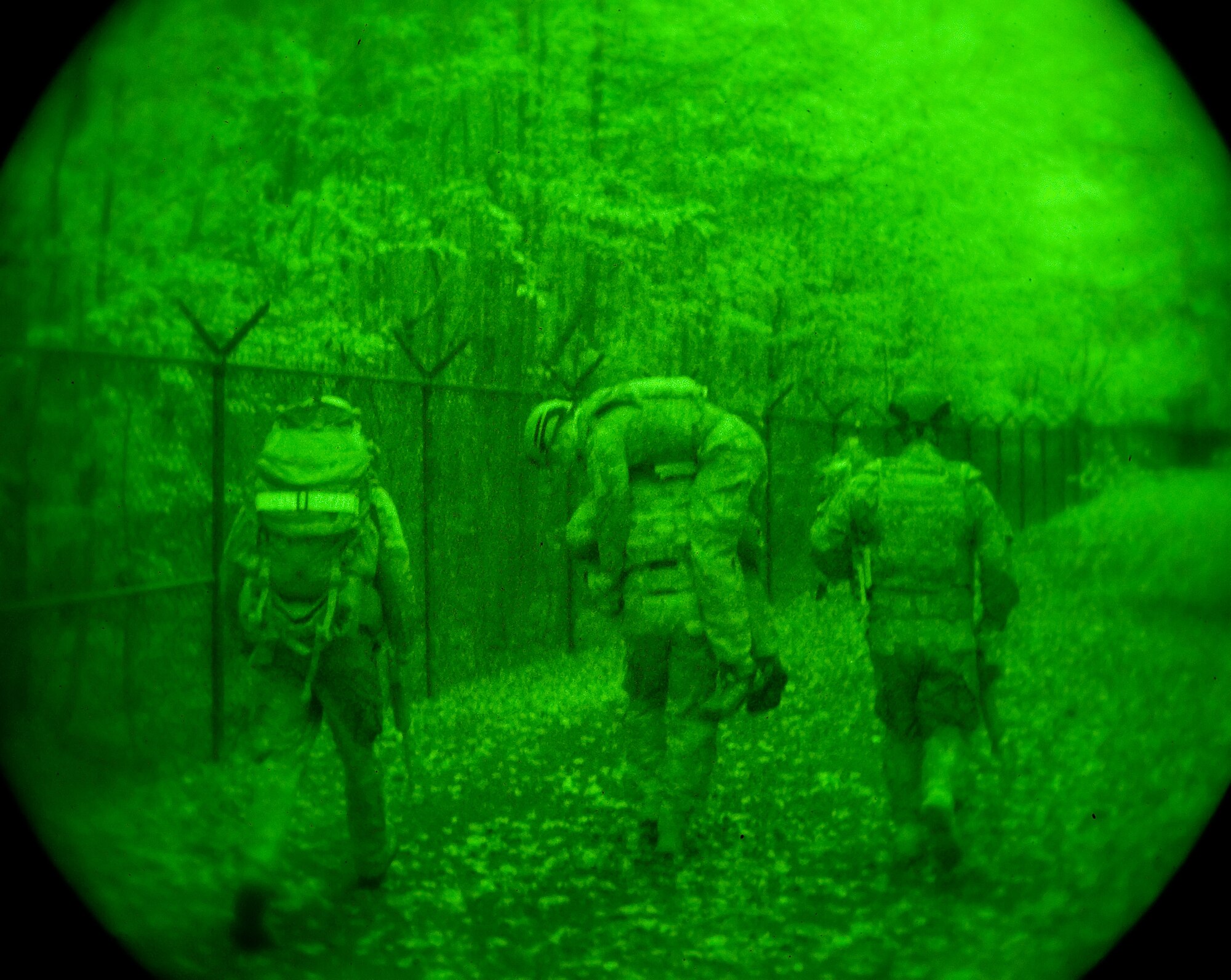 Airman 1st Class Colby Hillman, carries Airman 1st Class Andrew Vitale, both 436th Civil Engineer Squadron Explosive Ordnance Disposal technicians, to a simulated landing zone Oct. 10, 2014, on Dover Air Force Base, Del. EOD flight personnel had to get the simulated wounded to a landing zone within 20 minutes after coming under attack, extracted and delivered to a medical facility within the "golden hour." (U.S. Air Force photo/Roland Balik)