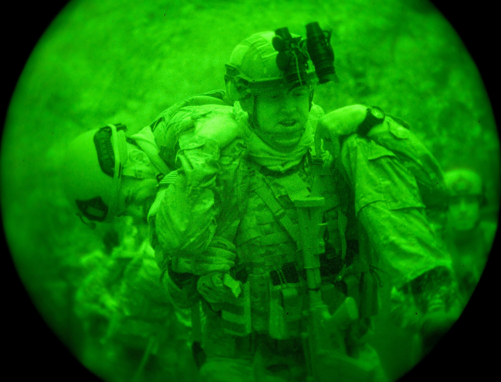 Airman 1st Class Colby Hillman, carries Airman 1st Class Andrew Vitale, both 436th Civil Engineer Squadron Explosive Ordnance Disposal technicians, to a simulated landing zone Oct. 10, 2014, on Dover Air Force Base, Del. Vitale suffered a simulated gunshot wound which required him to be carried to the landing zone for extraction by a helicopter. (U.S. Air Force photo/Roland Balik)