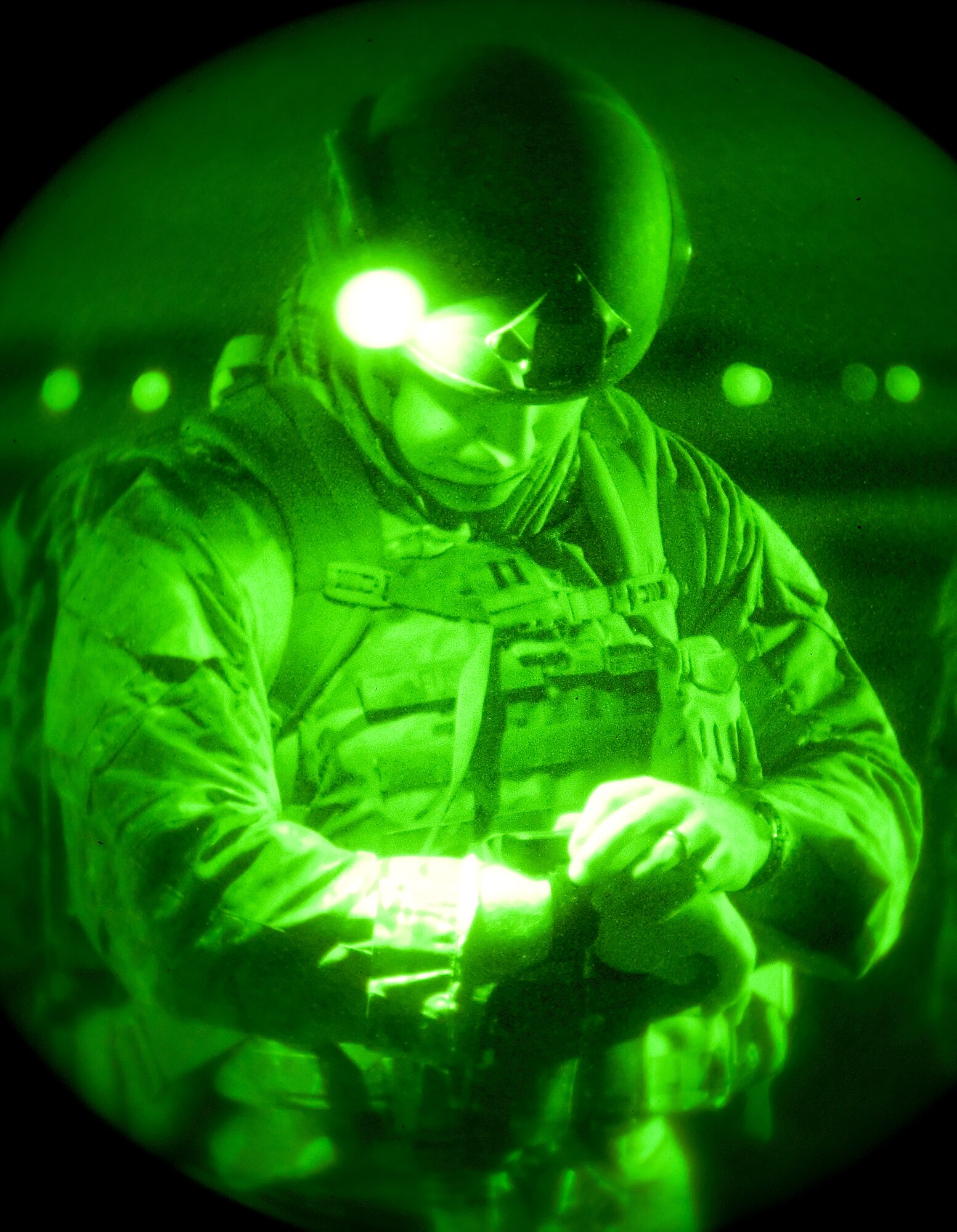 Capt. John Fuson, 436th Civil Engineer Squadron Explosive Ordnance Disposal flight commander, checks his GPS device prior to a three-mile hike Oct. 10, 2014, on Dover Air Force Base, Del. Fuson led a group of EOD personnel on a soldiering skills training event covering body armor set-up, ruck sack configuration, night vision goggle usage, troop movement techniques, noise discipline, hand and arm signals, react to contact, casualty carries and securing a landing zone. (U.S. Air Force photo/Roland Balik)