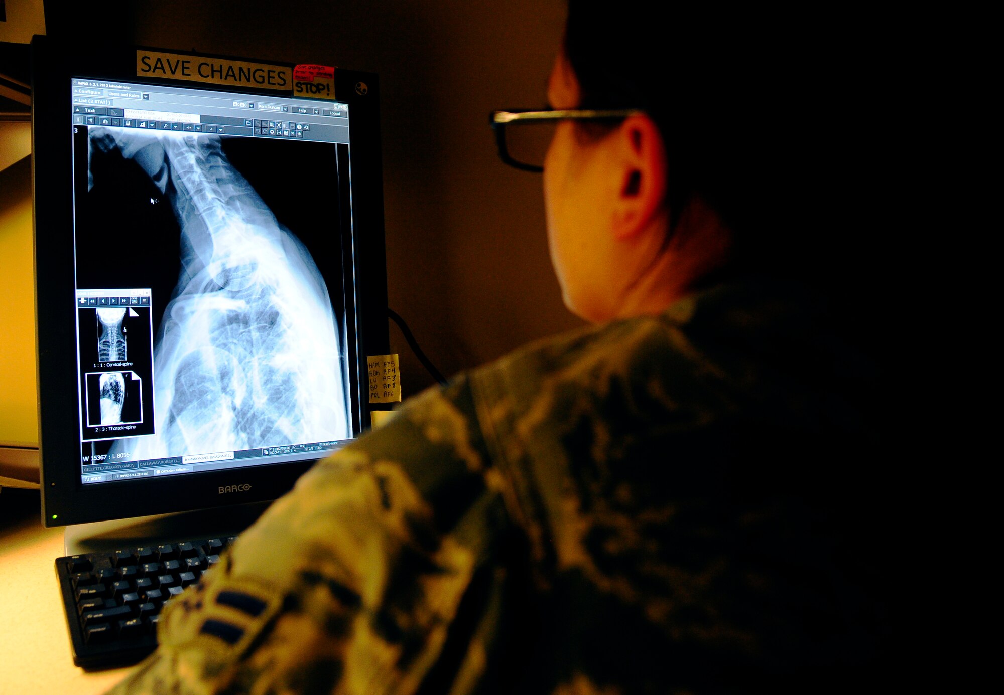Airman 1st Class Jessica Polacek, Phase II radiology technologist student, checks x-ray films from patients, for quality assurance Oct. 9, 2014 at MacDill Air Force Base, Fla. The Radiology Phase II technical School is an eight-month program that consists of classroom and practical studies.  (U.S. Air Force photo by Senior Airman Jenay Randolph/Released)