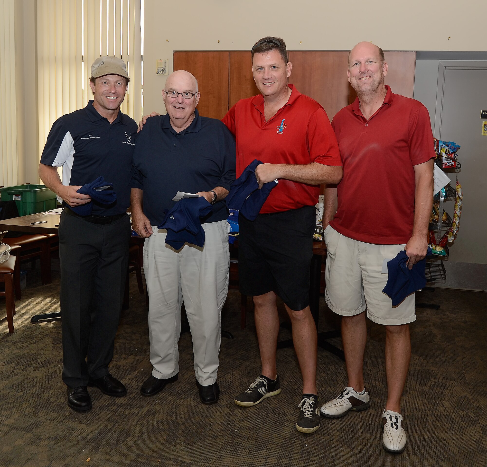 Group photo of contest winners who participated in the 436th Airlift Wing's 2014 Fall Bluesuiters Golf Tournament at Eagle's Landing Golf Course, Dover Air Force Base, Del., on Oct. 3, 2014. Key military leaders from Dover AFB were paired with local civic and business leaders for the Bluesuiters Golf Tournament as part of Dover's robust community outreach program. Dover AFB enjoys outstanding support from surrounding communities and events like this cement those ties. (U.S. Air Force photo/Greg L. Davis)