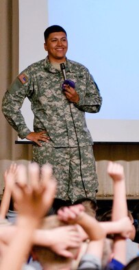 Spc. Oscar Roman of the Nevada Army Guard’s Honor Guard squad discusses flag etiquette with students at Virginia Palmer Elementary School in Sun Valley during a pre-approved speaking engagement. Before appearing or speaking at civic functions, Soldiers and Airmen should vet the request through their commander, the public affairs office and the judge advocate general’s office.  Photo courtesy Nevada Army Guard Honor Guard

 
