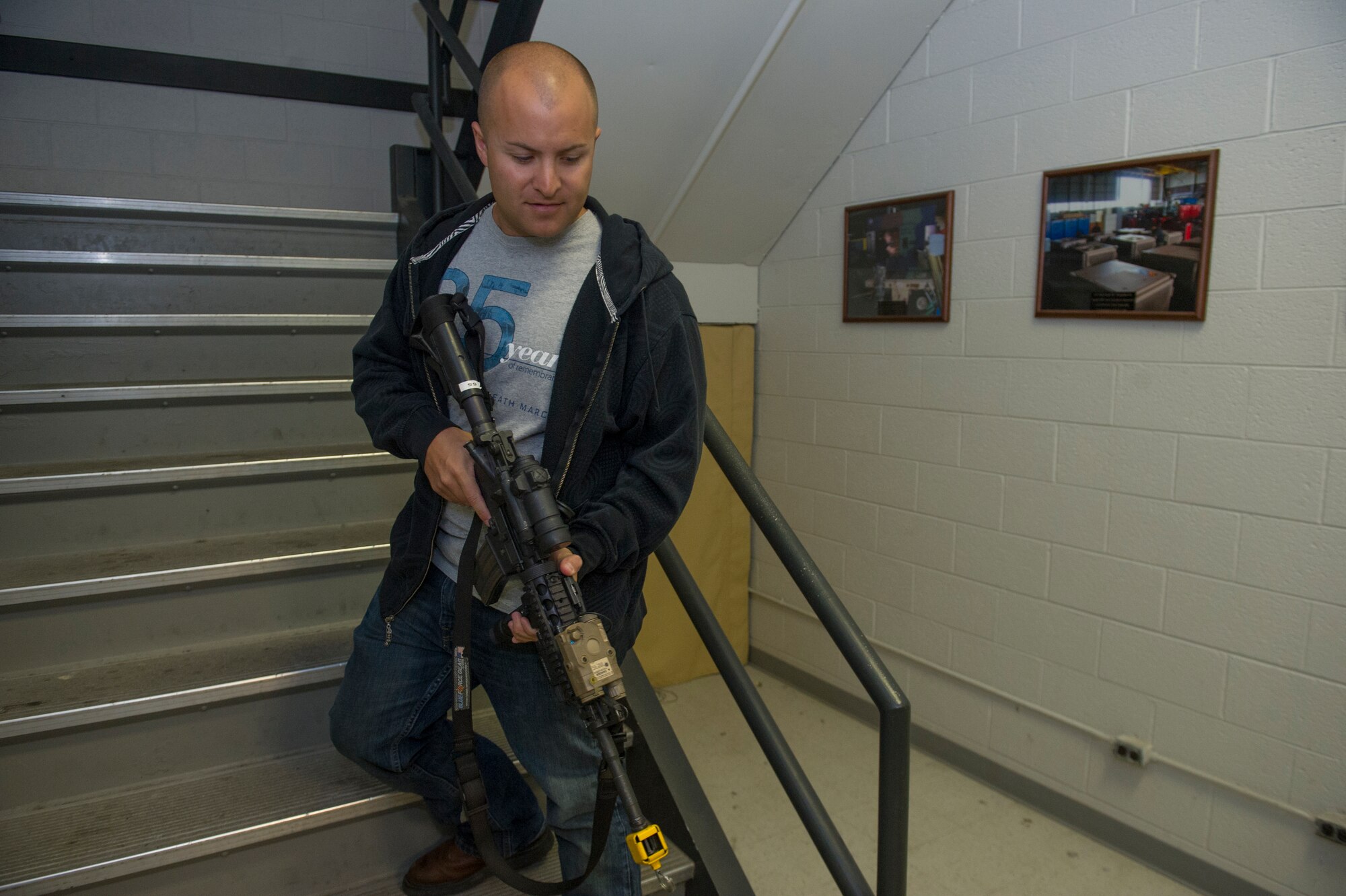 A member of Team Holloman plays the role of an active shooter during an exercise at Holloman Air Force Base, N.M., Oct. 9. Holloman maintains readiness to respond to emergencies such as active shooters by conducting training exercises multiple times a year. Members from the 49th Security Forces Squadron, 49th Civil Engineer Squadron and the 49th Medical Group were able to quickly respond to the exercise scenario, neutralize the threats and evacuate the victims. (U.S. Air Force photo by Airman 1st Class Aaron Montoya / Released)
