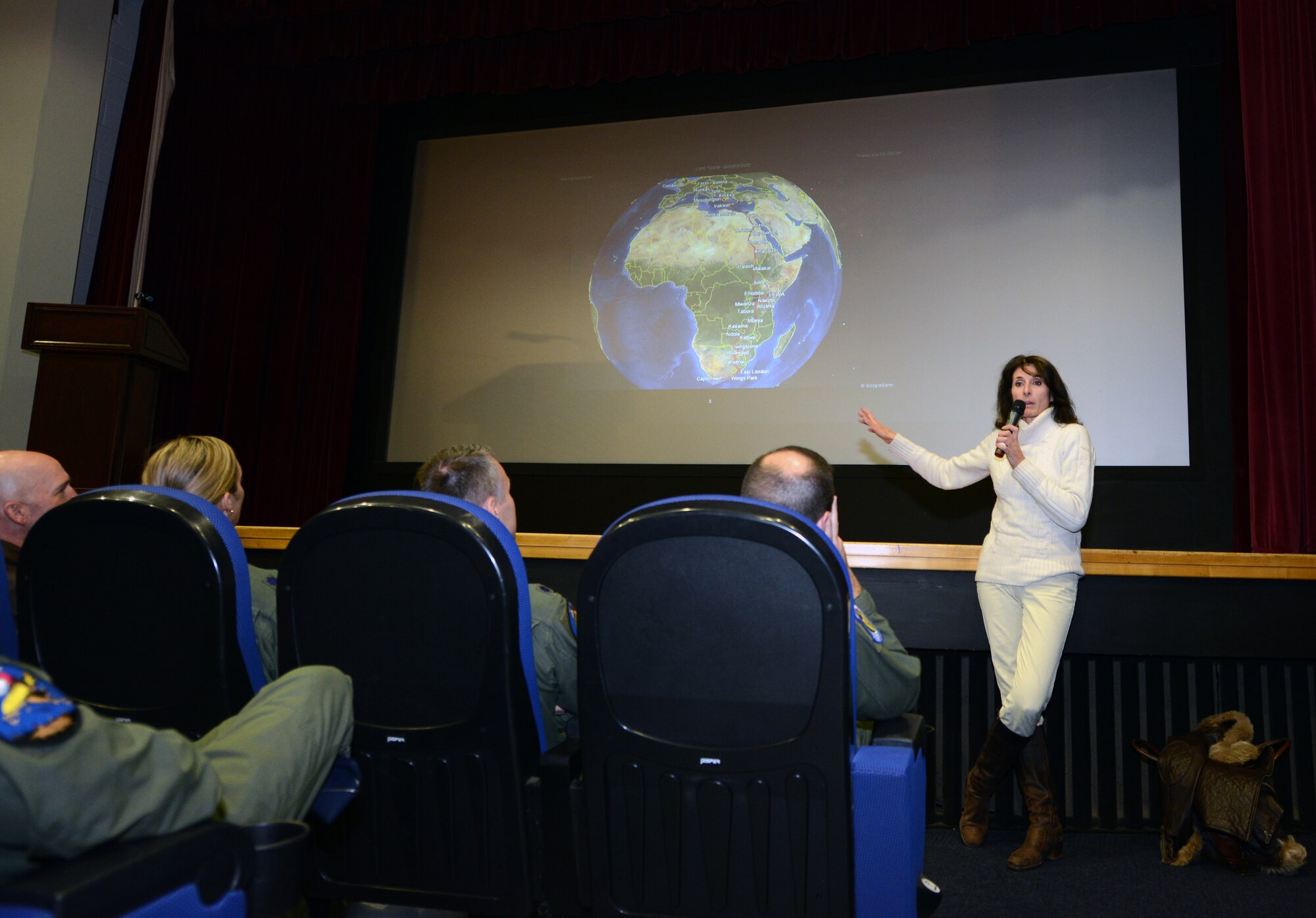 Tracey Curtis-Taylor, aviation enthusiast from Goodwood, England, explains the route she flew from Cape Town to Goodwood, England, to Team Mildenhall Airmen Oct. 10, 2014, on RAF Mildenhall, England. Curtis-Taylor’s presentation touched all aspects of her journey, from the preparations to the challenges and dangers she faced on route. (U.S. Air Force photo/Airman 1st Class Kyla Gifford/Released)
