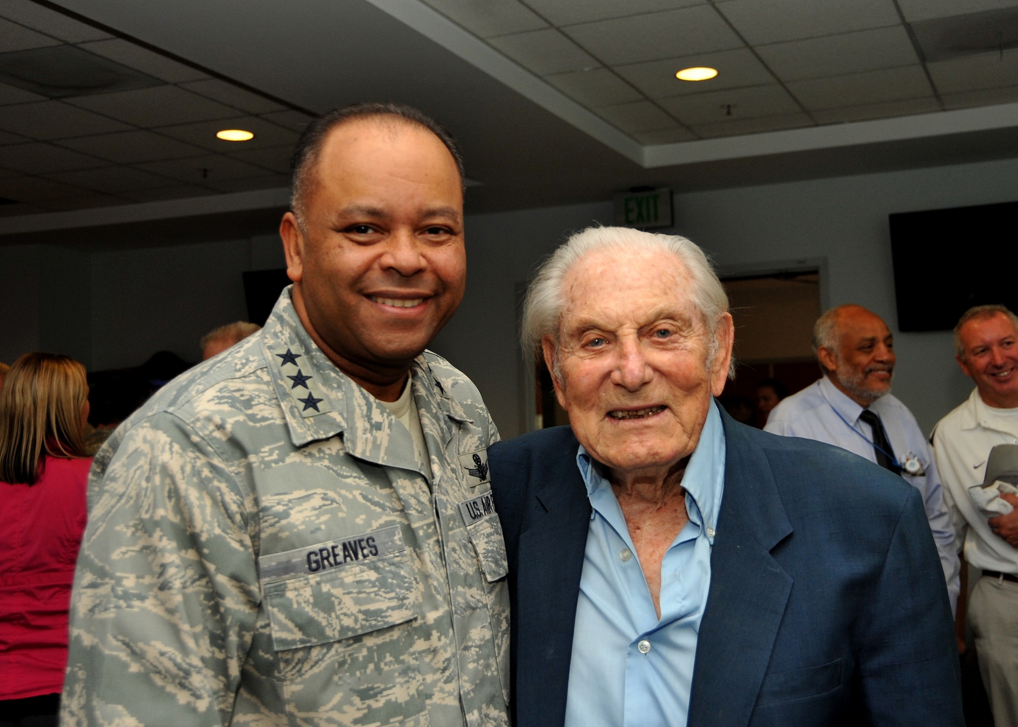 U.S. Air Force Lt. Gen. Sam Greaves, commander of the Space and Missile Systems Center chats with U.S Army Air Corps Lt. Col. (Ret.) Robert L. Hecker during a function hosted by the Air Force Association’s Bernard Schriever Chapter 147 at Los Angeles Air Force Base on October 3, 2014.  Lt. Col. Hecker flew B-17s in thirty missions over Europe, earning five Air Medals and the Distinguished Flying Cross.  After the war, Hecker began writing for radio and television, and has since become a prolific screenwriter, playwright, and producer.  (U.S. Air Force photo by Sarah Corrice) 