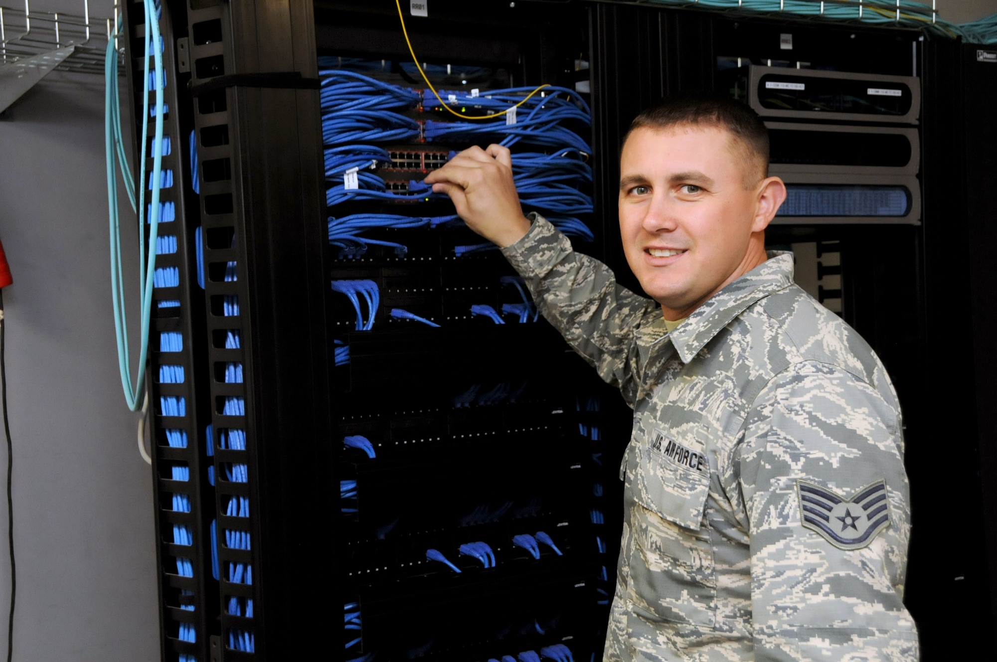 Staff Sgt. Chris Khoma from the 178th Communications Flight works on a computer system after the Command Cyber Readiness Inspection at the Springfield Air National Guard Base, Oct. 9. Khoma played a key role in preparing for the September CCRI, in which the inspection team graded the 178th with an Excellent score. (Ohio Air National Guard photo by Senior Master Sgt. Joseph Stahl/Released)
