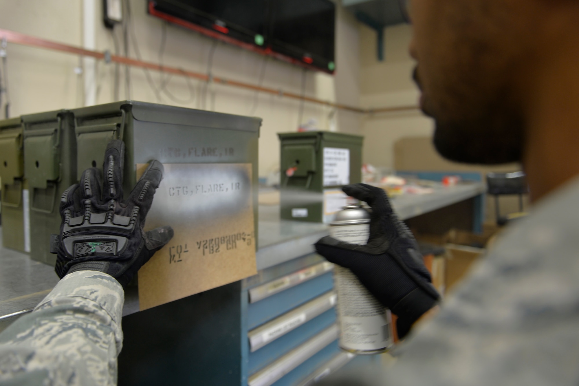 Senior Airman Richard Taylor, 86th Munitions Squadron conventional maintenance crew member, labels a BBU-35 impulse cartridge on Ramstein Air Base, Germany, Sep. 30, 2014. Without countermeasures, a C-130J would be more vulnerable to enemy projectiles. (U.S. Air Force photo/Airman 1st Class Michael Stuart)