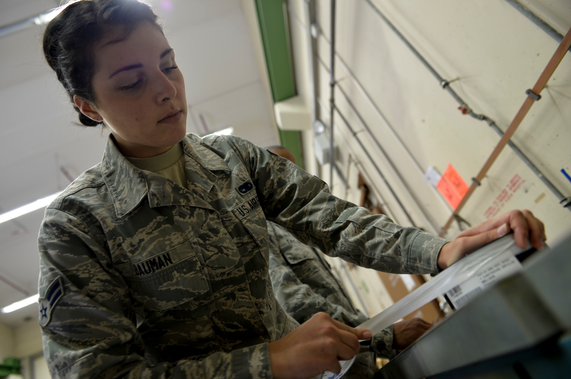Airman First Class Taylor Bauman, 86th Munitions Squadron conventional maintenance crew member, packages a BBU-35 impulse cartridge on Ramstein Air Base, Germany, Sep. 30, 2014. The BBU-35 impulse cartridges are used to initiate the counter measures loaded onto C-130s. Countermeasures help divert enemy attacks on aircraft.  After everything is marked and logged into a computer, it takes about two and a half hours with three to four Airmen to build one load of 420 countermeasures, which supports one C-130, additionally it takes about 30 to 40 minutes to load chaff and flares onto a C-130 if the load crew is ready. (U.S. Air Force photo/Airman 1st Class Michael Stuart) 