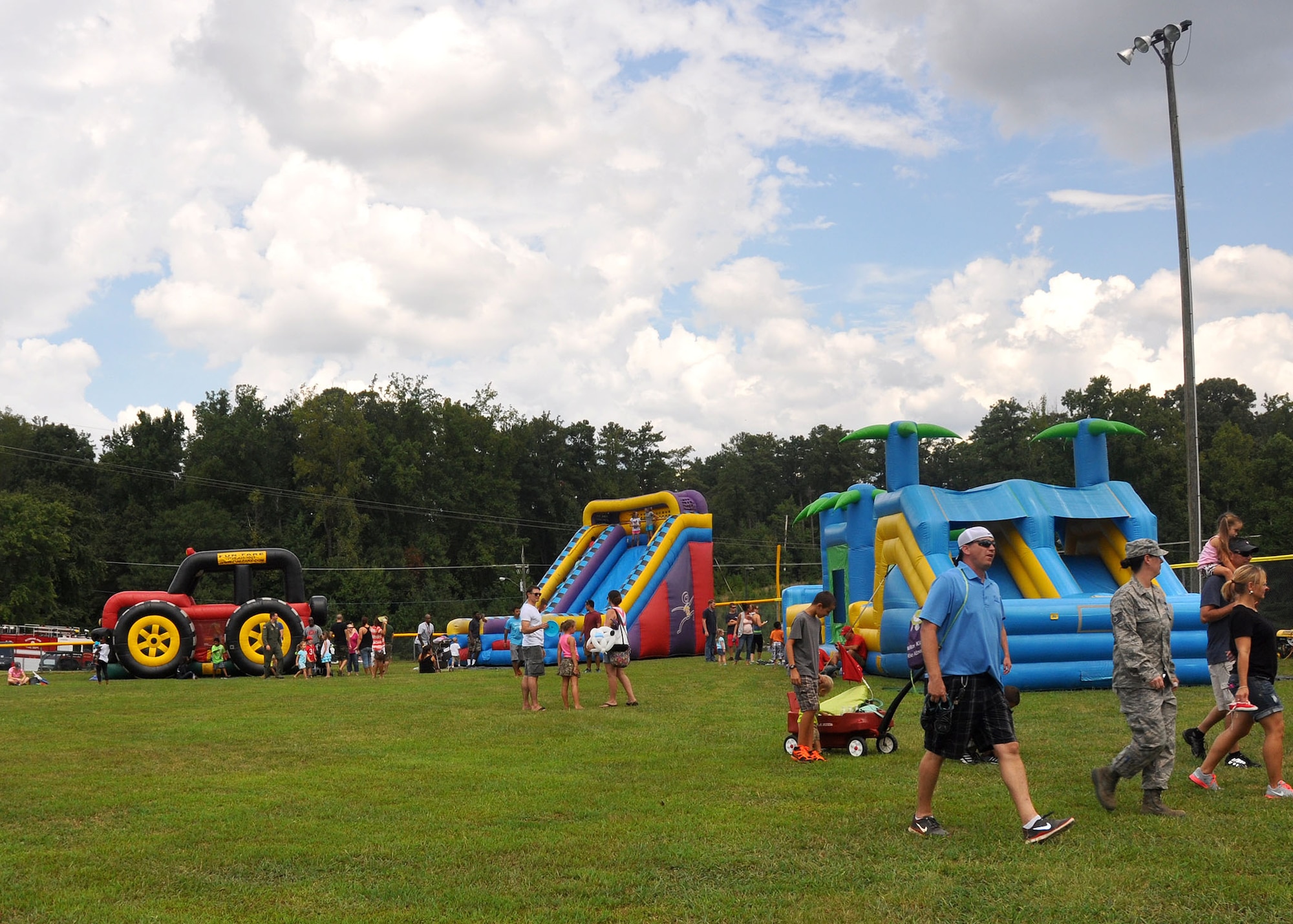 Military members and their families attend the annual wing family day here September 6 at Dobbins Air Reserve Base, Ga. The annual event is an opportunity for the reserve members and their families to get together for some fun and camaraderie. (U.S. Air Force photo by Staff Sgt. Karla V. Lehman/Released).