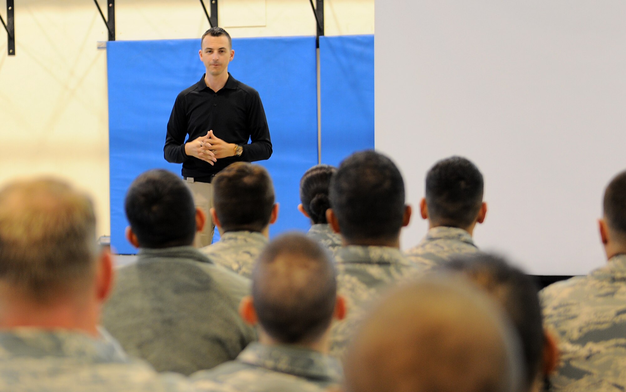 Brian Fleming, “The Blown-Up Guy,” a motivational speaker and a former Army infantry soldier, speaks to Team Mildenhall Airmen about how he was blown up twice Oct. 10, 2014, at the Hardstand Fitness Center on RAF Mildenhall, England. Fleming explained while he was deployed to Afghanistan, he was involved in an IED explosion and a suicide bomber attack. He also shared how he was resilient in overcoming his post-traumatic stress disorder caused by his experiences. (U.S. Air Force photo/Staff Sgt. Rachel Waller/Released)     