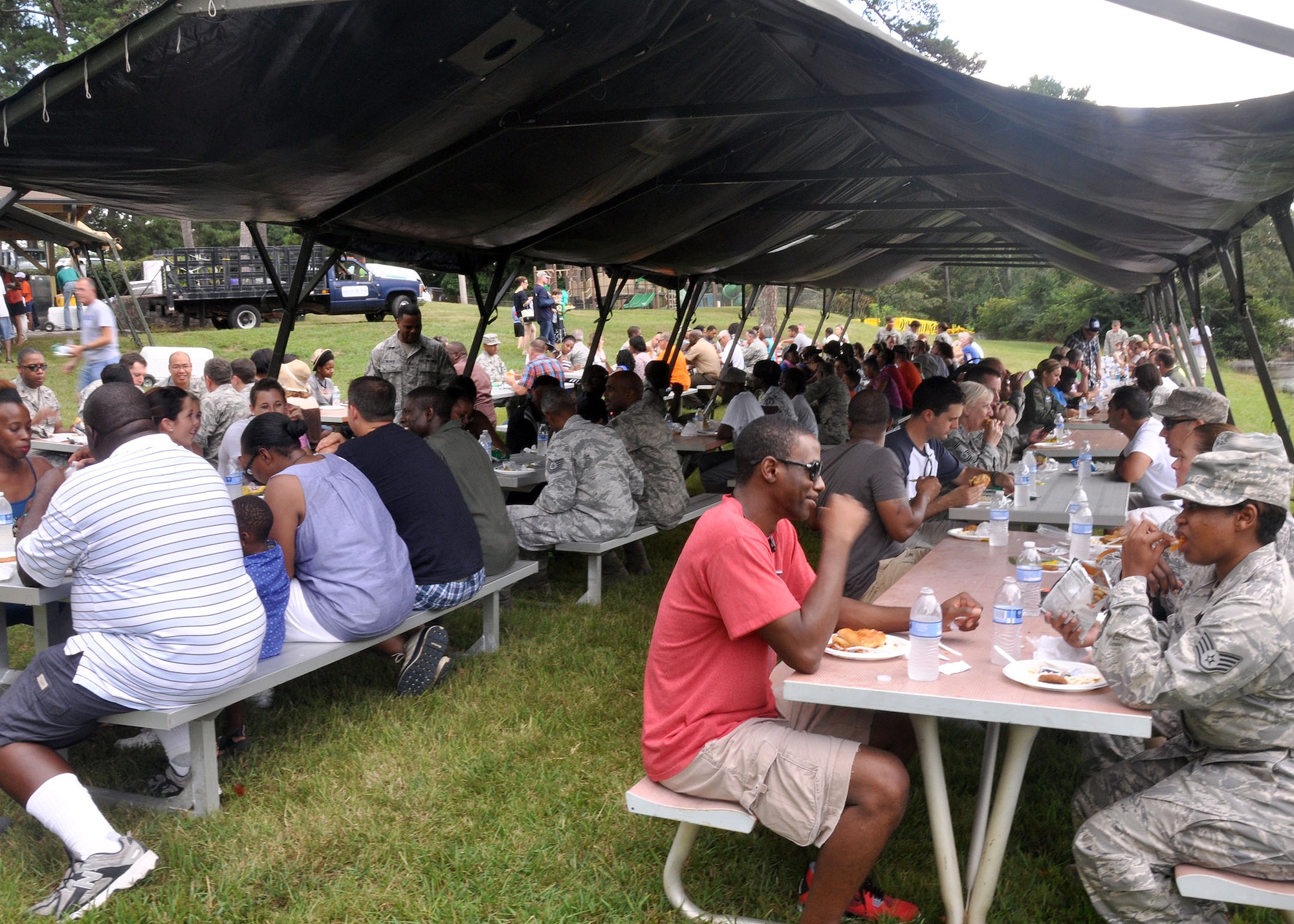 Reservist, families and friends take time to enjoy a picnic lunch at the 94th Airlift Wing Annual Family Day  Sept. 6, 2014 at Dobbins Air Reserve Base, Ga. Family Day is an opportunity for families to show their thanks and support to reserve members. 