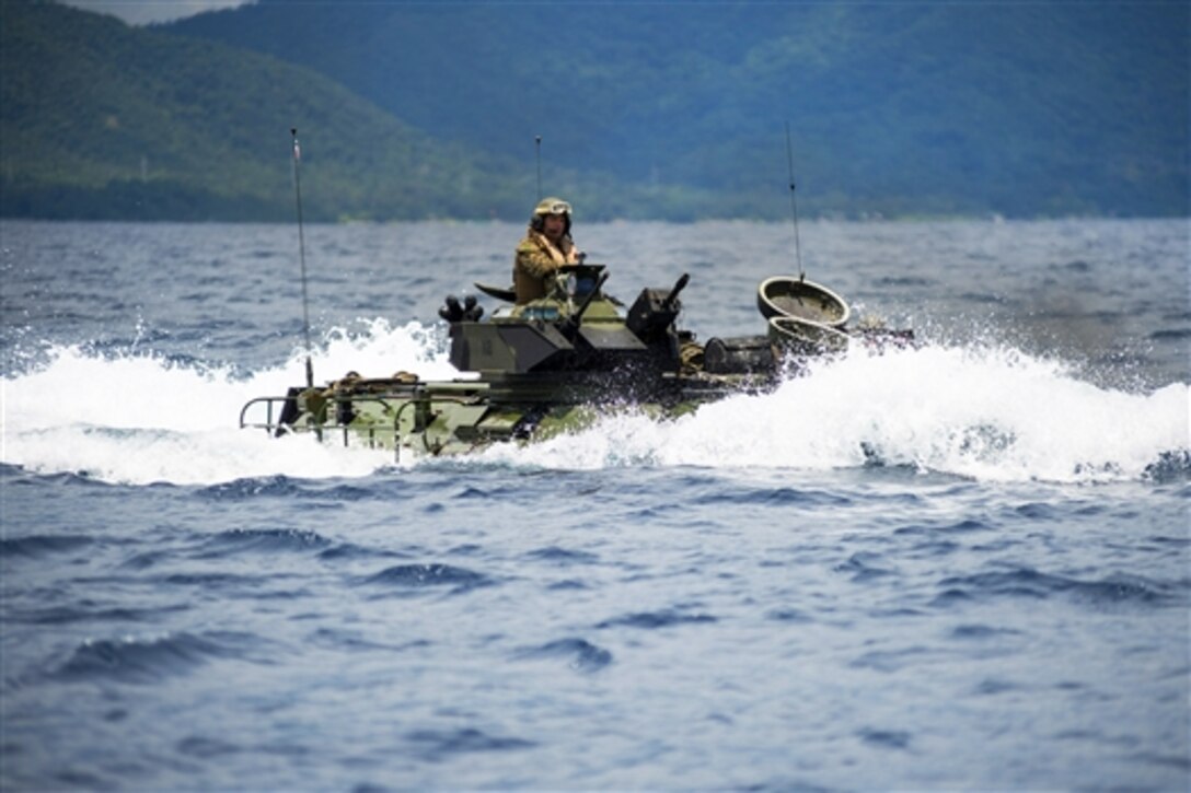 U.S. Marines maneuver an amphibious assault vehicle towards the amphibious dock landing ship USS Germantown during the Amphibious Landing Exercise, PHIBLEX 15, in the Sulu Sea, Oct. 2, 2014. PHIBLEX is an annual bilateral training exercise involving U.S. and Philippine forces. The Marines are assigned to the 31st Marine Expeditionary Unit.