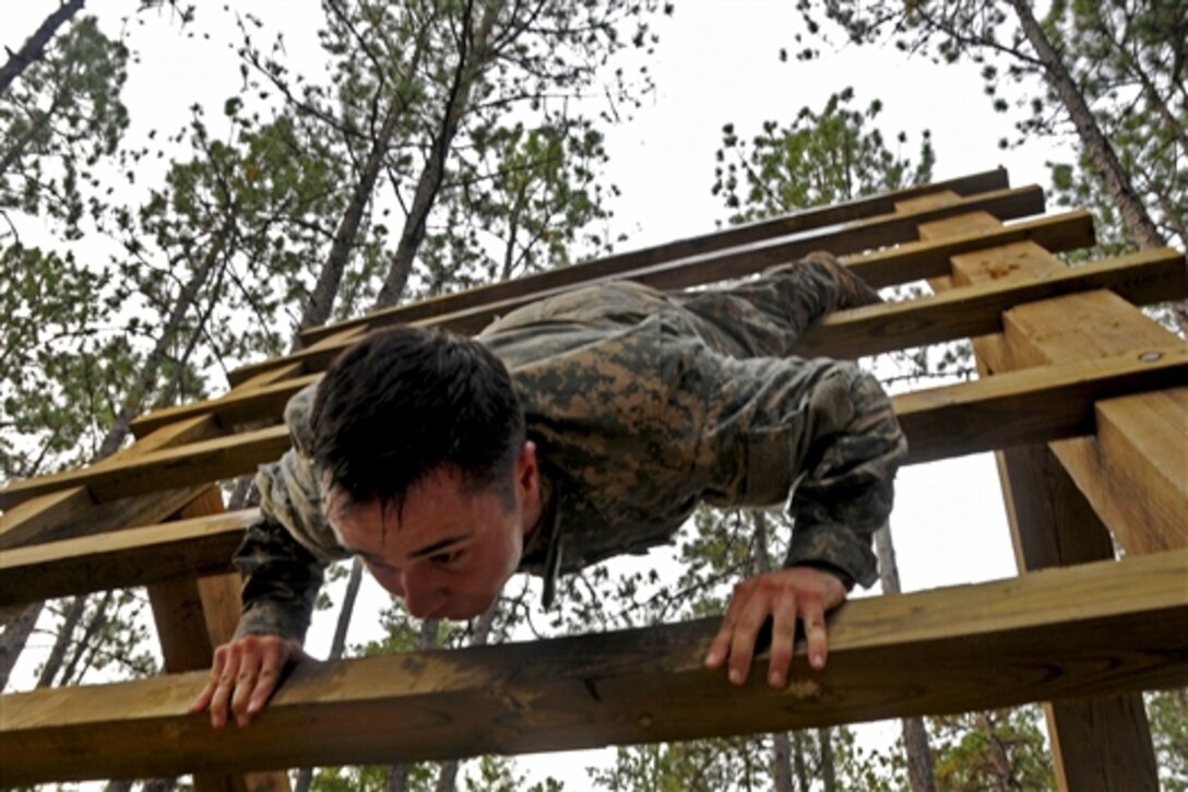 Army Spc. Beau Pratt navigates an obstacle course during the All-American Best Medic Competition on Fort Bragg, N.C., Oct. 7, 2014. Pratt is a medic assigned to the 82nd Airborne Division.