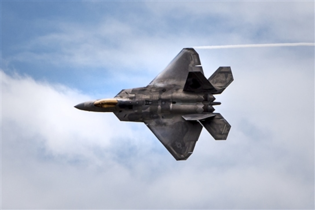 An F-22 Raptor demonstrates its maneuverability during the Wings Over the Pacific air show on Joint Base Pearl Harbor-Hickam, Hawaii, Sept. 28, 2014.