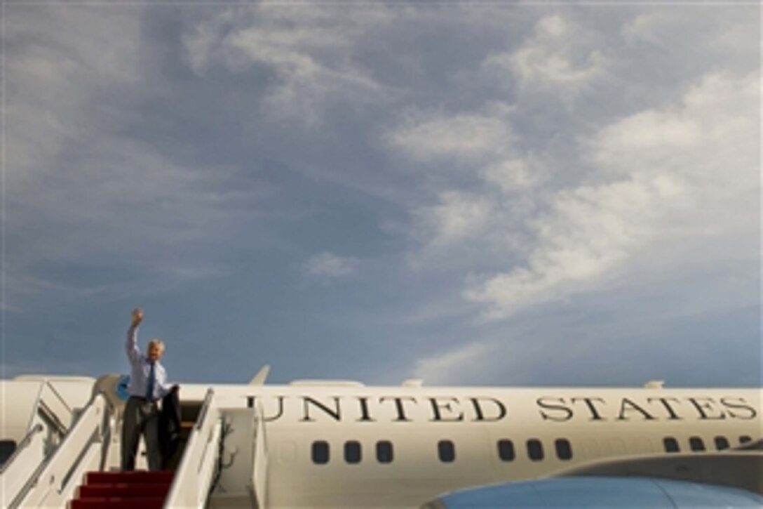 Defense Secretary Chuck Hagel waves goodbye as he departs Joint Base Andrews, Md., Oct. 9, 2014, to travel to South America to attend the 11th Conference of the Defense Ministers of the Americas.