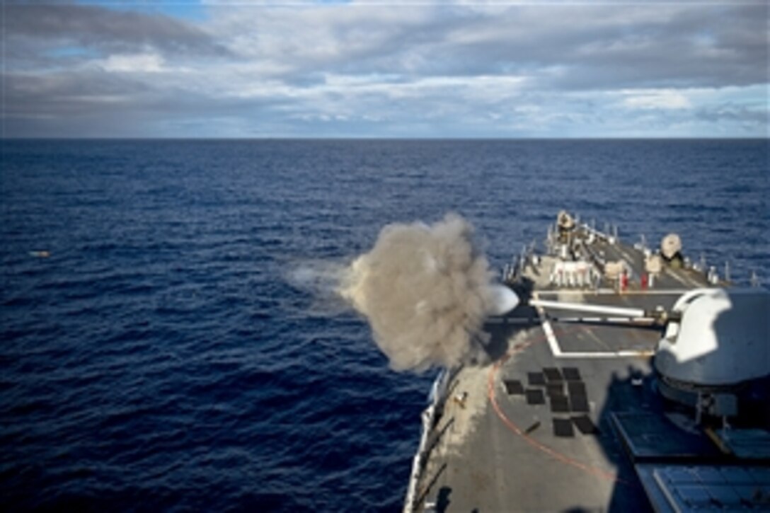 The USS Arleigh Burke fires its 5-inch gun during a live-fire exercise in the Mediterranean Sea, Oct. 7, 2014. The Arleigh Burke is conducting operations in the U.S. 6th Fleet area of responsibility in support of U.S. national security interests in Europe. 