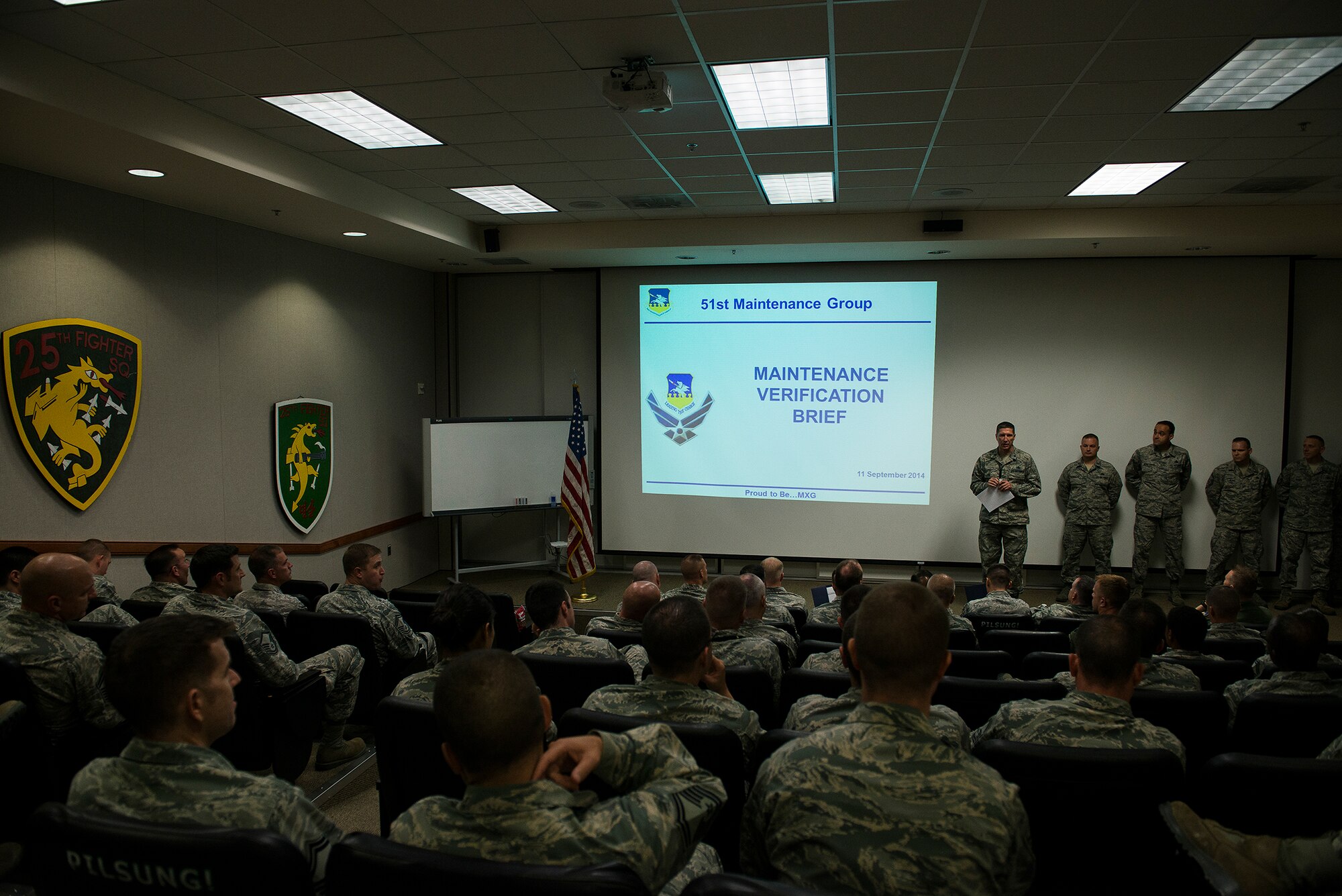 The 51st Maintenance Group holds a briefing on the results of their Maintenance Verification Process Sept. 11, 2014, at Osan Air Base, Republic of Korea. The maintenance verification process was a comprehensive review of the group's actual capabilities compared against what's required in the operations plan. (U.S. Air Force photo by Staff Sgt. Jake Barreiro)